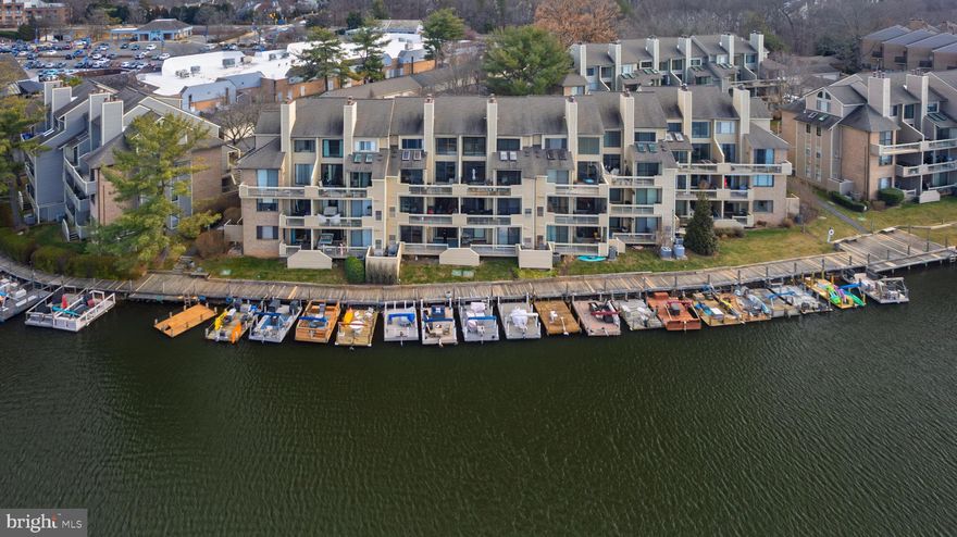 🏡✨ Located in the lakefront community of Harbor Point on Lake Thoreau, this stunning and rarely available first-floor condo offers the perfect blend of comfort, style, and convenience. Featuring 2 bedrooms and 2 full baths, this home delivers true waterfront living with breathtaking year-round water views 🌊 and a covered deck spanning the full width of the home — ideal for relaxing and entertaining. The home includes reserved parking space #62 🚗 right out front, plus an additional parking space with parking tag. Move-in-ready lakefront condos like this rarely come on the market!

🍽️🔥 The main level is ideal for entertaining, featuring an updated gourmet kitchen, open-concept dining and living areas, and a cozy wood-burning fireplace. The kitchen offers white shaker cabinetry with pull-out shelving, quartz countertops, under-cabinet lighting 💡, stainless steel appliances, and a breakfast bar. Sliding glass doors lead to the private covered deck with serene lake views 🌅, while the charming front porch courtyard offers another perfect spot for morning coffee ☕ or relaxing.

🪵☀️ Inside, enjoy wide-plank LVP flooring throughout and a bright, open floor plan. The home also features custom electronic blinds with remote controls 📱, including room-darkening blinds in the primary bedroom 🌙 for enhanced comfort and privacy. The primary suite 🛏️ is a peaceful retreat with lake views, private covered deck access, a custom walk-in closet with Elfa shelving and barn-door accent, and an updated en-suite bath 🛁. The second bedroom also features an en-suite full bath with designer tile and modern fixtures — ideal for guests or a home office 💻. Additional highlights include a convenient laundry room 🧺 and a large private exterior storage room just off the front courtyard — perfect for bikes 🚴, water gear 🛶, and seasonal items.

🚤🌿 Outdoor living is exceptional with private resident dock access. Boat slip availability is not guaranteed and requires application through Reston Association; registration is required (approx. $120/year). Slips are free and include electricity ⚡.

🛍️🍷 Located just steps from South Lakes Village Shopping Center with Red’s Table, Cafesano, Starbucks ☕, Safeway 🛒, spa 💆‍♀️, nail salon 💅, floral boutique 🌸, dry cleaners, and popular monthly farmers markets. Enjoy community events at Lake Thoreau 🎉, plus nearby Cross County and W&OD Trails 🚶‍♀️🚴 for endless recreation.

🏊‍♂️🎾 Residents enjoy full Reston Association amenities including 15 pools, 55 miles of trails, 4 lakes, 52 tennis courts, 18 pickleball courts, parks 🌳, and year-round community events. Convenient to Reston Town Center, Reston National Golf Course ⛳, Reston Station Metro Plaza 🚇, Wiehle-Reston Metro, Dulles Toll Road, Fairfax County Parkway, and Dulles International Airport ✈️. With breathtaking water views in a walkable, waterside community, this home is a rare offering for the most discerning buyers 💎.