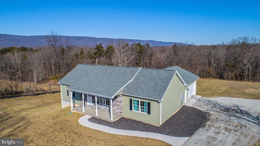 Reduced!Beautiful custom rambler with gorgeous mountain views, nice rear yard, spacious open floor plan with huge kitchen island, granite counters, gorgeous slate appliances and custom tiled back splash! This home has 3 bedrooms all  with walk in closets, lots of natural light and 3/4 inch  gleaming Oak hardwood floors. Master suite offers large walk in closet, separate garden tub and shower. Solid pine doors and trim throughout. Great covered front porch to enjoy the mountain and pastoral views. This home is a must see! HVAC with 9 year warranty.