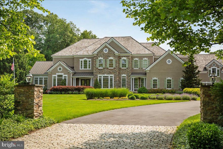 All we can say is WOW! You will not believe what this special property has to offer. Exquisite estate compound in Solebury, PA, located in the blue-ribbon New Hope-Solebury School District. Comprising of 3 buildings on two acres backing to 5 additional acres of open preserved space and a tree farm, the property includes: a 6-bedroom, 6 full and 2 half-bath residence with walk-in closets, formal living, dining and family rooms, chef’s kitchen with Wolf 6-burner double oven & dual Sub-Zero refrigeration, sunroom, home office, two laundries and a fully finished basement with additional family room, flex room, gym, and storage; 4 car attached garage, another detached 2 car garage with spacious office above (792 s.f.) with fireplace, pool storage; a fully conditioned versatile accessory building (2,170 s.f.) offering indoor basketball, pickleball, volleyball, hitting cage, and big-screen TV area. Manicured grounds feature heated in ground pool, bluestone hardscaping, full security & camera system, sprinkler system, natural gas generator (no buried tanks), well & septic. A rare opportunity for multi-use luxury, recreation, and work-from-home all in one private, meticulously maintained Bucks County estate.  This homesite captures the essence of exclusivity; a super private, southern-exposed backyard sanctuary seamlessly set within an upscale community.