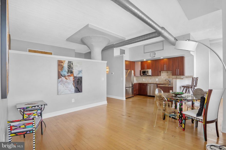 New Availability at Marine Club! Unit 705B is a spacious bi-level one-bedroom condo with DEEDED garage parking - perfect for first-time buyers, empty-nesters, or investors. The grand living area features hardwood floors, high ceilings, and extra-tall windows flooding the space with natural light. The open kitchen offers abundant cabinet space, granite countertops,  Kitchen Aid stainless steel appliances including new dishwasher, and a large breakfast bar with stool seating.

Upstairs, find a generous lofted bedroom with hardwood floors and a deep closet. The newly renovated bathroom features a Jacuzzi tub, stall shower with seamless glass enclosure, modern vanity, and a laundry closet with stackable washer/dryer.

Marine Club is pet-friendly with 24/7 front desk, fitness center, and courtyard featuring seasonal seating and a koi pond. Located at the intersection of Graduate Hospital, Bella Vista, Passyunk Square, and Point Breeze, the building offers low fees, reasonable taxes, and rental-friendly policies. Steps to Broad Street subway, Target, Sprouts, and countless restaurants. Walking distance to Center City. Schedule your showing today!