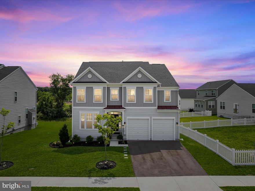 Stunning turnkey home  built by Brookfield Residential in 2023 with approximately 3,959 finished sq ft | 4 BR/3.5 BA | 0.19 acres located in the sought-after Snowden Bridge, with community pool, play pirate ship and numerous amenities.  Engineered wood floors flow throughout the main level,  which features a lovely foyer, living room, dining room, pantry area, family room, sunroom, & gourmet kitchen with quartz countertops, 5-burner gas cooktop, tile backsplash, and island with storage on both sides.  Enjoy the reverse osmosis water system with sink tap, which is also set up to feed water to the refrigerator.   The sunroom off the kitchen extends your living area and leads to a gorgeous composite deck with black balusters and steps down to a paver patio with  pergola with adjustable louvres. The nicely-sized yard rolls gently toward the back with plenty of privacy and green space.  Don't miss the newly updated main level half-bath with board and batten wall finish.  
Upper Level, you'll find four generous sized bedrooms.  Bedrooms 2, 3 & 4  each have walk-in closets and ceiling fans. The primary suite features two walk-in closets and a spa-like bathroom with beautiful tile,  dual vanities and an oversized walk-in shower with bench. The bedroom level laundry room also has engineered wood floors & the washer/dryer are included.
Downstairs, you'll find the basement with finished and unfinished areas and walk out access to the back yard.  Note the 9 ft ceilings & the thick padding under the carpet!  Here, you'll find a recreation room, full bath, and an unfinished area.  (Gym equipment does not convey.)    This room can be converted to media room/bedroom with the existing egress. In the utility room, you'll notice a whole house water filter system (owned) and a high efficiency water softener (owned).  Gorgeous blinds have been added to the windows!  You'll find modern finishes and fixtures throughout the home.  The sellers have also added wall-mount garage door openers and overhead storage in the garage.   Just move in...your new home is ready for you!