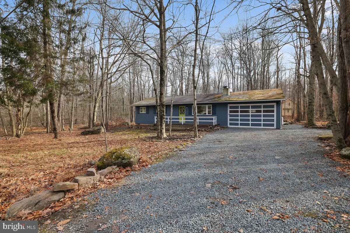 Welcome to your dream retreat in the heart of Mount Pocono! This beautifully updated ranch home features 3 spacious bedrooms and 1.5 baths, nestled on a serene, wooded lot that offers both privacy and tranquility.
Step inside to discover a cozy living space highlighted by a gas fireplace, perfect for those chilly evenings. The inviting kitchen flows seamlessly into the family room, where you can enjoy the comfort of the mountains during the summer months. The home is designed for relaxation and entertainment, boasting a delightful wine nook and an outdoor eating area that beckons for al fresco dining.
Outside, indulge in the ultimate outdoor lifestyle with a hot tub, a wood fire pit, and a grilling area, ideal for gatherings with family and friends. Explore the community’s amenities, including picturesque lakes, skiing opportunities, and scenic hiking trails, ensuring there's always something to do.
Even in the warm summer months, the home remains comfortable thanks to ceiling fans and cool evening breezes, making air conditioning in the common areas a luxury rather than a necessity.
This property has a proven track record as a successful Airbnb rental for over two years, generating consistent income. Whether you’re looking for a personal getaway or an investment opportunity, this ranch home is a perfect choice. Don’t miss your chance to own a piece of paradise in Mount Pocono!
The Locust Lake Village allows golf carts and ATV's within the community. Also boasts several lakes for water sports and swimming, tennis courts and play areas. This home is being sold fully furnished.