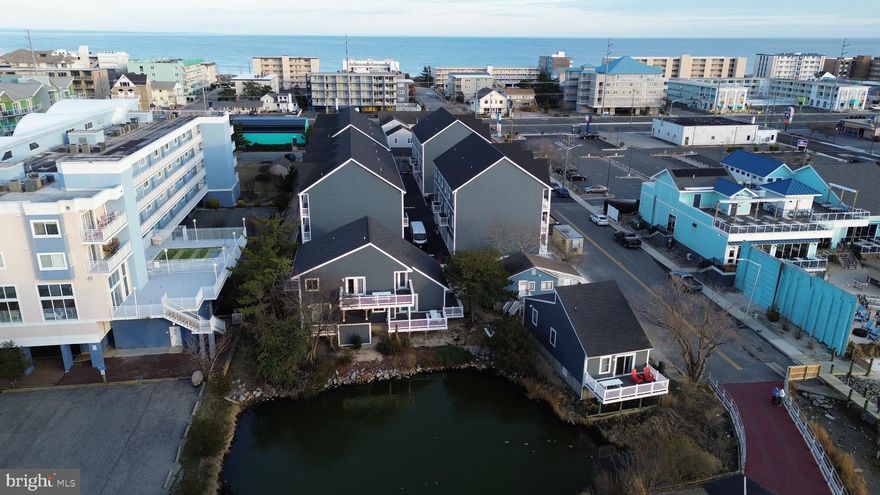This bayfront, income-producing multi-unit property on 75th Street in Ocean City, MD presents a rare opportunity to own a unique compound overlooking Assawoman Bay. Situated on two parcels, Tax ID #2410086868 and Tax ID #2410086841, the property includes three separate buildings offering exceptional water views from each structure and strong rental performance potential.

The complex consists of one two-bedroom house, two three-bedroom units, and one four-bedroom unit, totaling twelve bedrooms and nine full bathrooms. Each unit is designed to maximize views and functionality, creating an ideal setup for vacation rentals, multi-generational use, or a private waterfront retreat.

The property has been substantially improved with a new roof and new siding on two of the three buildings, raised foundations, extensive interior renovations, and the addition of a storage unit, making this a turnkey opportunity with reduced future capital needs.

Unit A offers three bedrooms and two bathrooms, sleeps up to ten guests, features central air conditioning, and showcases excellent bay views. Unit B includes two bedrooms and one bathroom with wall air conditioning and baseboard heat and presents a clear value-add opportunity for future redevelopment on the existing raised foundation. Unit C features a large updated kitchen, four spacious bedrooms, three full bathrooms, central air and heat, and expansive bay views, comfortably sleeping up to twelve guests. Unit D has been nicely updated with granite countertops, large bedrooms and bathrooms, three bedrooms and three full baths, central air conditioning, excellent water views, and sleeps up to ten.

All units are furnished in a coastal style and include laminate flooring, updated countertops, large flat-screen televisions, refrigerators, and microwaves. The property also features a community washer and dryer on site, an outdoor shower, on-site storage, and a large driveway with thirteen off-street parking spaces, allowing guests to park once and walk to nearby midtown shops, restaurants, and the beach.

Located just blocks from the ocean with direct bay access only steps away for paddleboarding or kayaking, this property delivers both the lifestyle renters seek and the income investors value. With large decks, stunning bay sunsets, and a flexible multi-building layout, this is a rare midtown Ocean City waterfront compound offering immediate income and long-term upside. Professional photos to follow.