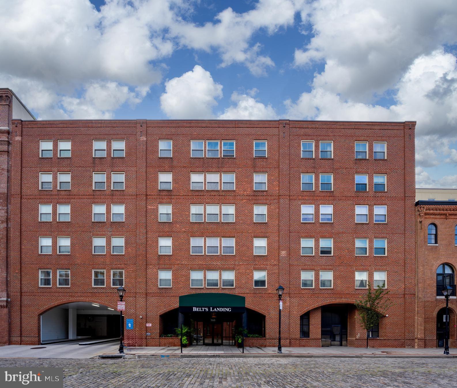 Welcome to the heart of Fells Point, where history meets modern living. This expansive 1-bedroom, 1.5-bath condo offers thoughtfully designed space and a private balcony with direct waterfront views.
Step inside to a light-filled, open-concept layout that seamlessly connects the dining area, living room, and kitchen—perfect for both relaxing and entertaining. The generously sized living spaces create an inviting flow, while the kitchen offers ample storage and functionality.
The spacious primary suite includes a walk-in closet and a large en suite bath with dual vanities, soaking tub, and separate shower. A powder room off the main hallway adds convenience for guests. Additional features include in-unit laundry, abundant storage, and two dedicated garage parking spaces.
Enjoy your morning coffee on the balcony as you watch the boats drift by—or step outside to explore one of Baltimore’s most walkable and beloved neighborhoods. From cobblestone streets and local boutiques to acclaimed dining, Greedy Reads bookstore, Broadway Square Farmers Market, and vibrant nightlife, Fells Point offers the best of city living with a historic twist.
The building features secure entry, 24-hour concierge service, and convenient guest parking, making everyday living and entertaining hassle-free.
Key Features:
1 Bedroom | 1.5 Baths
Private balcony with water views
Open-concept living and dining
Spacious kitchen with laundry room
Walk-in closet & en suite bath
24-hour front desk concierge
Two garage parking spaces included
Guest parking available