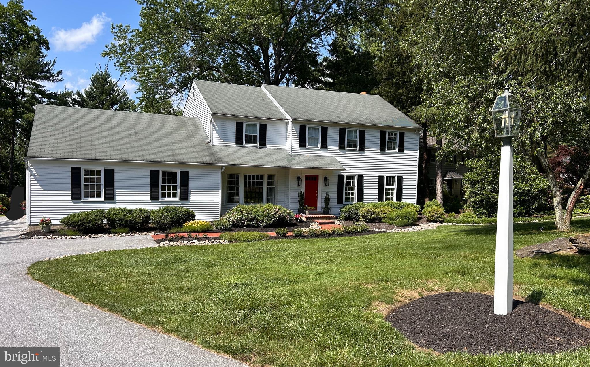Thoughtfully upgraded four-bedroom, two-and-a-half bath center hall colonial in Wayne neighborhood. Located on a quiet, no-through-traffic street in the award-winning T/E District, this home sits on a flat, beautifully landscaped 0.75-acre lot bordered by mature woods and adjacent to township open space—a rare find, ideal for a future pool or playground. Inside, custom architectural updates improve light and flow, with extensive millwork throughout, including oversized crown molding, wainscoting, and finished hardwood floors. The main level features generous room sizes, including an updated kitchen and powder room, formal living and dining rooms, a family room with working fireplace, a den/study off the kitchen, and a separate laundry room. Upstairs includes a primary suite with en suite bath, walk in closet, and a separate dressing room with additional closet space. Three additional bedrooms share a full hall bath. The finished lower level provides a den/flex space with an above-grade feel, plus a dedicated office constructed with built-in sound dampening for privacy.