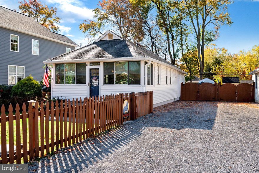 Available for rent in the highly desirable Beverley Beach community, this charming home offers two spacious bedrooms and two full bathrooms, including an en suite in the primary bedroom. The updated kitchen is complemented by a cozy living room, dining area, front sunroom, and back deck. The fenced-in backyard features a custom-built fire pit area, perfect for relaxing, along with two sheds for extra storage. An extended gravel driveway provides ample parking for several cars. The community is nestled between the West and Rhode Rivers, the Chesapeake Bay, and the Beverly/Triton Beach Nature Preserve, residents enjoy access to a bayfront beach, playground and a private marina.