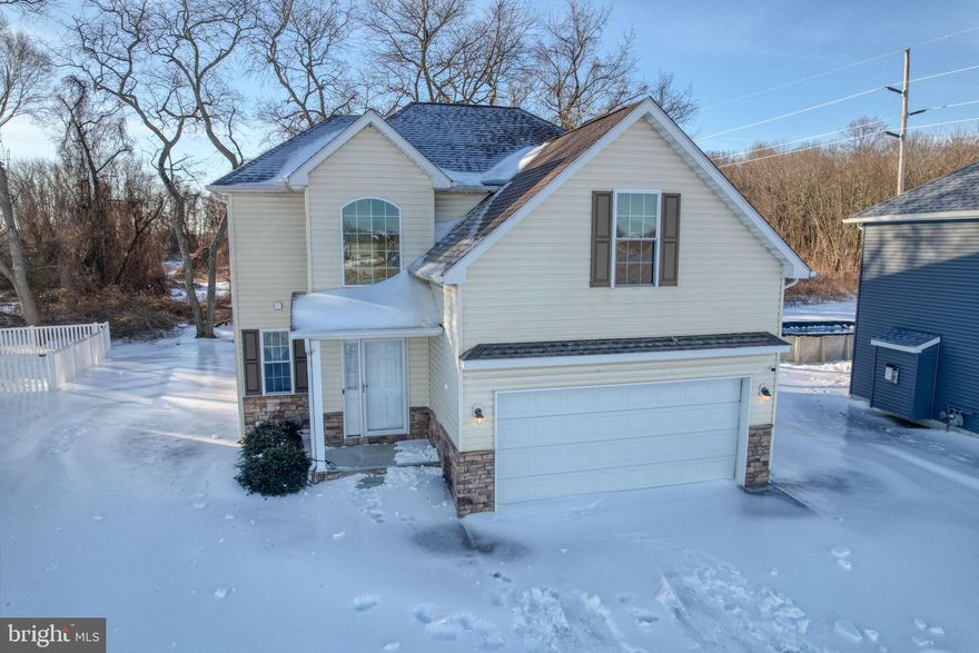 Welcome to this charming 4‑bedroom, 2.5‑bath home located in the heart of Wyoming, DE—just a short walk to town and minutes from schools, medical facilities, shopping, and popular local restaurants. Set at the back of a quiet community, this two‑story home has just been freshly painted throughout and offers both convenience and privacy. The property backs to mature woods, creating a peaceful backdrop and a sense of seclusion.  Inside, you’ll find a bright and functional layout. The kitchen features granite countertops, stainless steel appliances, and a spacious pantry—perfect for everyday cooking or entertaining. The adjoining living and dining areas offer comfortable gathering spaces with views of the private backyard.  Upstairs, the primary suite features a full bath and a spacious walk-in closet. Three additional bedrooms provide ample space for guests or a home office.  Enjoy the convenience of a covered front porch entry and a two‑car garage, which adds extra storage.  This home blends small‑town charm with modern comfort—an ideal place to settle in and enjoy all that central Delaware has to offer.