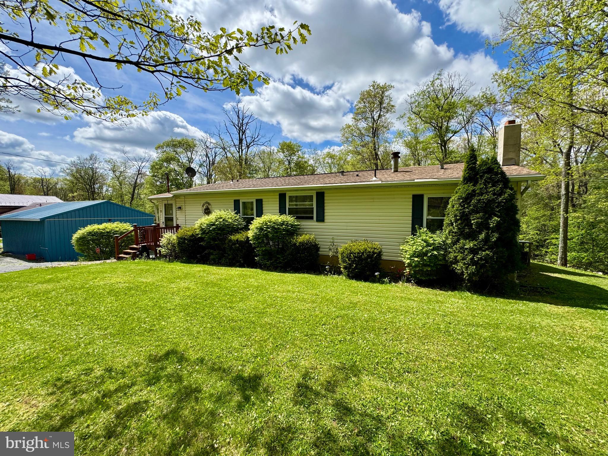 Great Location! only 20 minutes from State College and 15 minutes to Bellefonte. This spacious home has 3 bedrooms and 2 full bathrooms. The large addition offers an enormous 23' X 20" primary bedroom and a bonus room. The lower level has lots of living space a wood burning stove and a bar. There is a 7'X5' room in the lower level that could be finished as another bathroom. The new windows and central air offer comfort and energy efficiency.
The home has an over-sized, heated 2 car garage and a large detached garage/workshop. There is also a storage shed. You will love all the extra storage space!
The outdoor space is amazing. The 1.02 acres backs to beautiful mountain forest land. This summer enjoying the mountain views and spending time around the campfire.
Call today to schedule your private showing.