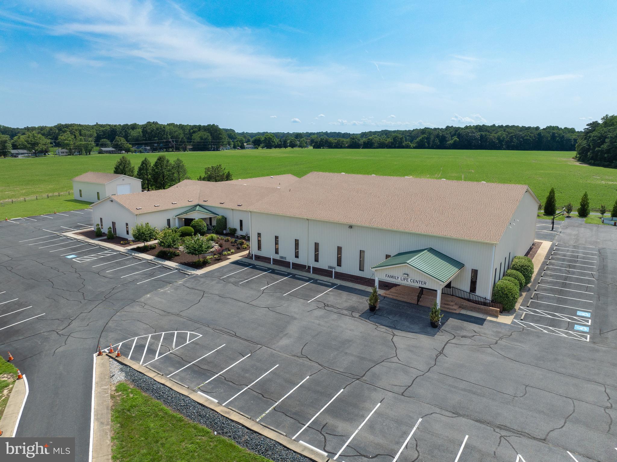 Rare Opportunity for an amazing Church facility. We are offering a unique opportunity on an 8.52-acre property currently utilized by Trinity Church. The main building, encompassing 24,908 square feet, features an inviting entryway, two distinct sanctuaries with the primary one accommodating up to 700 attendees including mezzanine seating, a built-in baptismal tub. The building has a kitchen, multiple office spaces, and a youth hangout area. The property also includes a +/- 1,500 SF warehouse with a large bay door and a +/- 2,500 SF house. With 108 marked parking spaces and additional space for more, this property is perfectly suited for various uses and offers ample flexibility for prospective buyers or tenants.