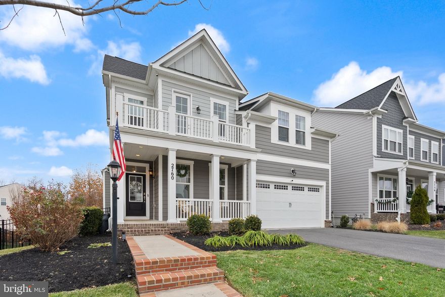 Move-in ready, nearly new, and ready to impress from the moment you arrive! Welcome to this Torrington Model home in Potomac Shores! Homes like this are rare. Built in 2021 and meticulously maintained, this exceptional Craftsman offers the perfect combination of style, space, and location. Move-in ready and nearly new, it sits in one of the community’s most sought-after spots, boasting striking curb appeal, a welcoming front porch, and a fully fenced yard—ready for its next owner without the wait or cost of new construction.

Inside, a versatile floor plan features 5 bedrooms, 4.5 baths, a private office, and a fully finished basement, designed for modern living. Open, sun-filled spaces and thoughtful finishes create a home that feels both elegant and inviting.

The designer kitchen anchors the main level with an oversized island for gathering, upgraded stainless steel appliances, and abundant prep and storage space—ideal for everyday life and entertaining. It flows seamlessly into the family room, offering a bright and welcoming space to relax or host with ease.

Step outside to the low-maintenance Trex deck and enjoy a private, fully fenced yard—perfect for summer gatherings, pets, or play.

The home offers two primary suites—one on the main level and a second upstairs—both featuring walk-in closets and spa-inspired baths with dual vanities and glass-enclosed showers, providing flexibility and luxury for multigenerational living or guests.

Upstairs, the additional bedrooms provide space for family, work-from-home, or visitors.

The finished lower level adds even more versatility with a large recreation area, fifth bedroom, full bath, and private office or den—perfect for guests, hobbies, or additional living space.

A two-car garage, extended driveway, and ample storage complete this exceptional home.

Set within award-winning Potomac Shores, residents enjoy resort-style amenities including multiple pools, tennis and basketball courts, playgrounds, scenic trails, a fully equipped fitness center, and a vibrant social barn. Walk to the Jack Nicklaus Signature Golf Course, community center, and the future Town Center.

Commuter Convenience: Potomac Shores is home to the future VRE station, with the parking garage already completed. When it opens, it will provide a direct rail connection to Alexandria and Washington, D.C., on the Fredericksburg Line—making commuting effortless.

High-speed internet is included with the HOA, with shopping, dining, and entertainment at Potomac Mills and Stonebridge just minutes away.

Move-in ready, nearly new, and located in one of Northern Virginia’s most desirable communities. Schedule your private showing today!