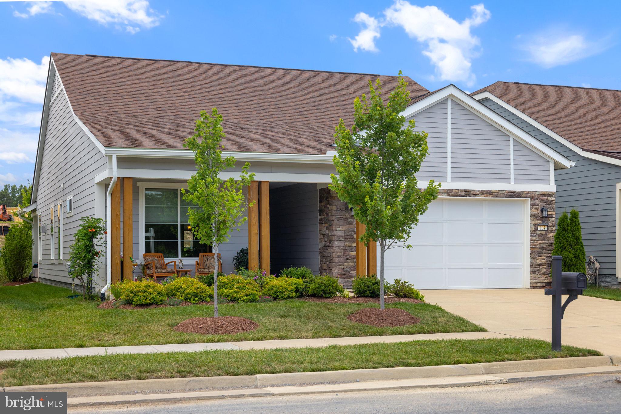 There’s a certain kind of ease that washes over you when a home just fits, it gets everything right from the start. Tucked inside Lake Frederick’s sought-after Trilogy community, this 1,632-square-foot retreat is as stylish as it is low-maintenance. Built in 2020, it delivers the best of modern living with the kind of comfort you’ll look forward to every day.<br><br>
From the curb, its Craftsman inspired charm catches your eye right away: wood columns, stonework accents, and a charming front porch for morning coffee or casual chats with a neighbor. Step inside and the open layout flows effortlessly, anchored by a crisp, contemporary kitchen with white soft-close cabinetry, gleaming quartz counters, pendant lighting, and a stainless-steel appliance suite. Whether you're cooking for one or hosting a group, everything you need is right where it should be.<br><br>
The living area centers around a slate-surround gas fireplace with a built-in blower. It's cozy in the winter and adds ambiance all year. Natural light filters in through large windows and slider that opens onto a covered rear patio, where the real relaxation begins. Professionally hardscaped and landscaped for privacy and beauty, the backyard oasis includes a hot tub and firepit lounge, your personal haven under the stars.
Back inside, the layout keeps things easy with smart storage everywhere you look. A spacious laundry and mudroom area with extended cabinetry, built-in sink, and extra shelving simplifies your routines, while the 2’ extended garage gives you room for tools, gear, and elbow space.<br><br>
Comfort upgrades are already in place: a whole home humidifier, blown-in fiberglass insulation for efficiency, and a radon mitigation system for peace of mind. Every detail, from the soft close drawers to the seamless indoor-outdoor living, shows that this home was designed for the way people actually live.<br><br>
Lake Frederick feels more like a resort than a neighborhood. Centered on a 117-acre lake, this 55+ gated community is packed with amenities: indoor and outdoor pools, tennis and pickleball courts, a top-tier fitness center, eight miles of trails, and a dog park. The Shenandoah Lodge is your everyday escape, complete with a farm-to-table restaurant, golf simulation, game rooms, and a members-only lounge.
In a home like this, weekends stretch longer, mornings feel lighter, and evenings become something to savor. The upgrades are done. The lifestyle is waiting. And the welcome mat is already out.br><br>
And when you’re ready to explore, Skyline Drive, Shenandoah National Park, Luray Caverns, and even nostalgic Dinosaur Land are all close by. It’s the kind of place that makes every day feel like a getaway—and it’s all waiting for you.