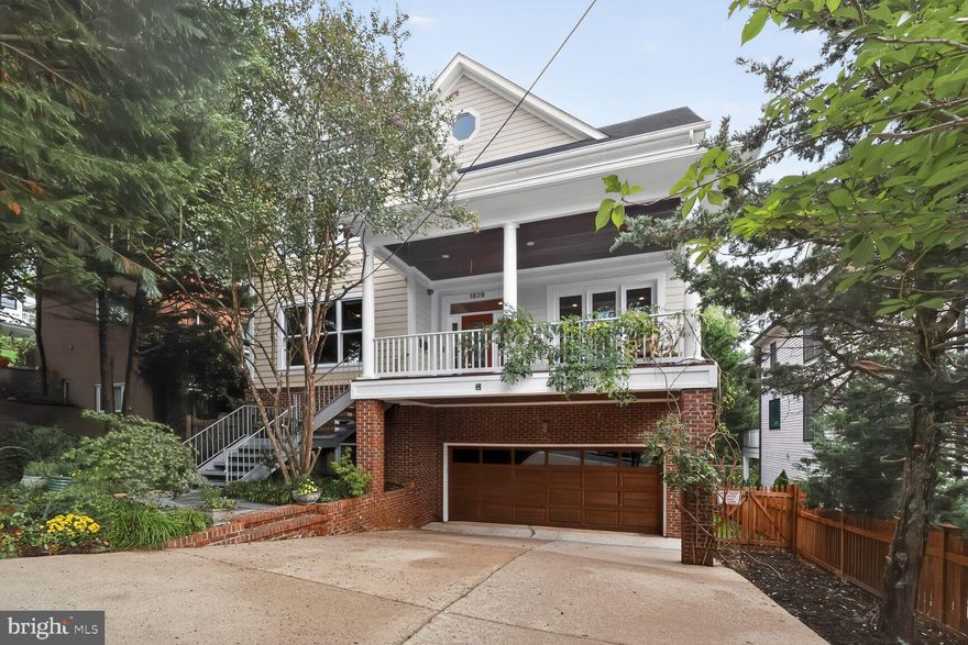 LUXURIOUS RESORT STYLE LIVING with WATER VIEWS and SPORT COURT!! Located in the Heart of the Palisades/Berkley on sought-after 47th Place, the most charming street with direct stunning views of the Reservoir and the tree-lined horizon of Virginia! The spectacular custom professional SPORT COURT is the perfect platform for pickleball, tennis, basketball, soccer, street hockey, and more! The beguiling interiors are ensconced in sunlight and greenery.
This quintessential six-bedroom home with fabulous vistas in all directions is accessed by an inviting front porch with sweeping sunset views.  A marble entry foyer leads to the formal Living Room w/ Fireplace, formal Dining Room, and opens to the expansive Gourmet Kitchen and Family Room w/ Fireplace, with French Doors to the rear deck, which overlooks the mature tree canopy and Rear Grounds.  A Home Office with custom mahogany built-ins and floor to ceiling windows also enjoys Reservoir views.  A powder room completes this level. 
The spacious Primary Suite with vaulted ceilings, Fireplace, and walk-in closet adjoins the sumptuous Primary Bathroom, with its jetted whirlpool tub and walk-in steam shower. There are three additional Bedrooms on this level, with en-suite Bathrooms. 
The Terrace level features a second Family Room w/ Fireplace opening through French Doors to the Rear Grounds, leading to the Bluestone expansive patio area with stone hearth fireplace, and SPORT COURT. There are two additional ample Bedrooms with en-suite Bathrooms on this level, perfect for multi-generational living. A dedicated Laundry Room and interior Garage access provide convenience.  
The coveted Palisades/Berkeley neighborhood is beloved for its historic charm, proximity to the restaurants, shopping, and the venues of MacArthur Blvd, the weekly Farmer's Market, the easy access the C &O Canal, the Capital Crescent Trail, the Trolley Trail, and the Palisades Recreation Center. Minutes to Georgetown, Downtown, and Reagan National Airport.