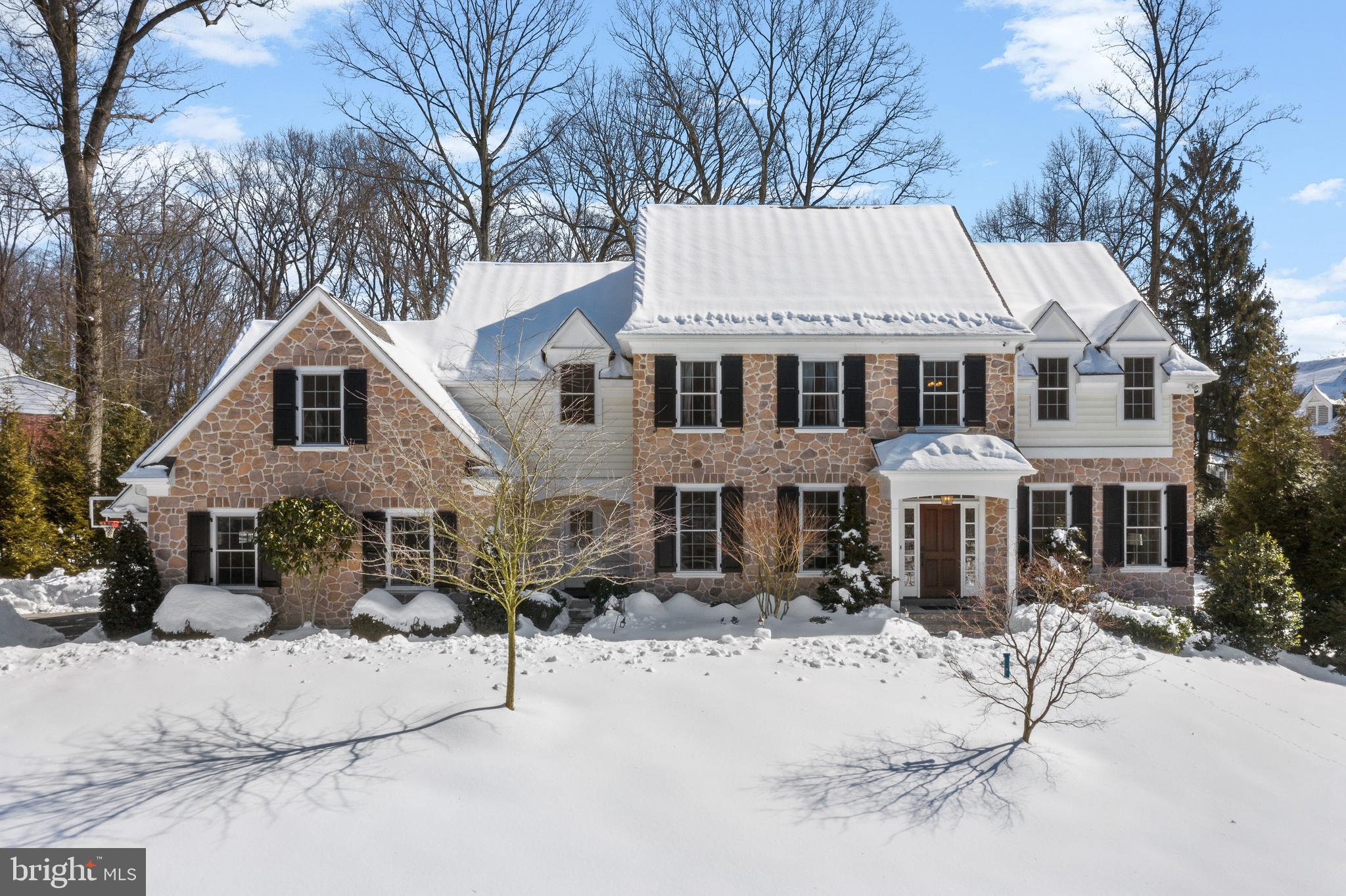 You will be amazed this pristine home is not brand new! Custom built by Pohlig Builders, this home has a bright floorplan with nine foot ceilings throughout the first floor and offers flowing spaces for family living and entertaining. The light filled view through foyer, with its elegant oak staircase and French door to the rear yard, separates the formal dining room and living room. The Living room features a stunning floor to ceiling custom mantel gas fireplace. French pocket doors lead to the Library off of the living room, a pleasant space for an in home office or stealing away with a good book. The Kitchen features cabinetry to the ceiling, a Wolf 6 burner double oven range, Thermador dishwasher, drawer microwave and two Thermador refrigerators paneled to match the cabinetry. There is a prep sink on the large cherry island and the Kitchen is open to the Morning Room and Family Room with a wall of windows overlooking the back yard. The charming Morning Room is the perfect family hub with french door slider to a flagstone patio and stone fire pit. The Great Room has a cathedral ceiling and gas fireplace with floor to ceiling mantle. There are two Powder rooms on this level - a formal powder room and second one conveniently located in the mudroom. The mudroom is huge with a built in bench, ample closets, and access to the side yard and three car garage. Site finished hardwood floors are throughout the first floor and the second floor hallway. Upstairs, you’ll find a tranquil Master Bedroom suite with large dressing area and two cabinetry outfitted walk in closets. The cathedral ceiling Master bath has a two person vanity, oversized frameless door shower, soaking tub and separate commode room. There are four additional spacious bedrooms on this level, two with ensuite baths and two with a shared bath. The fifth bedroom is tucked away at the end of the hall and is a lovely private suite. The laundry room is also conveniently located on this level, making this chore a little easier. The finished lower level is an expansive recreation area complete with a Cherry wet bar with counter seating , a wine chiller and two freezer drawers. There is also a full bathroom and a sunlit sixth bedroom with French doors to the rear yard. The rear yard has plenty of green space, and your own persimmon, apple and pear trees, all surrounded by privacy trees and estate fencing. A generator offers peace of mind as well as the security password entrance gate and home security system. Located in the highly acclaimed Tredyffrin /Easttown School District, with Beaumont Elementary. Walk to the Upper Main Line YMCA or a short hop to the Daylesford train station, the best restaurants and all the Main Line has to offer.