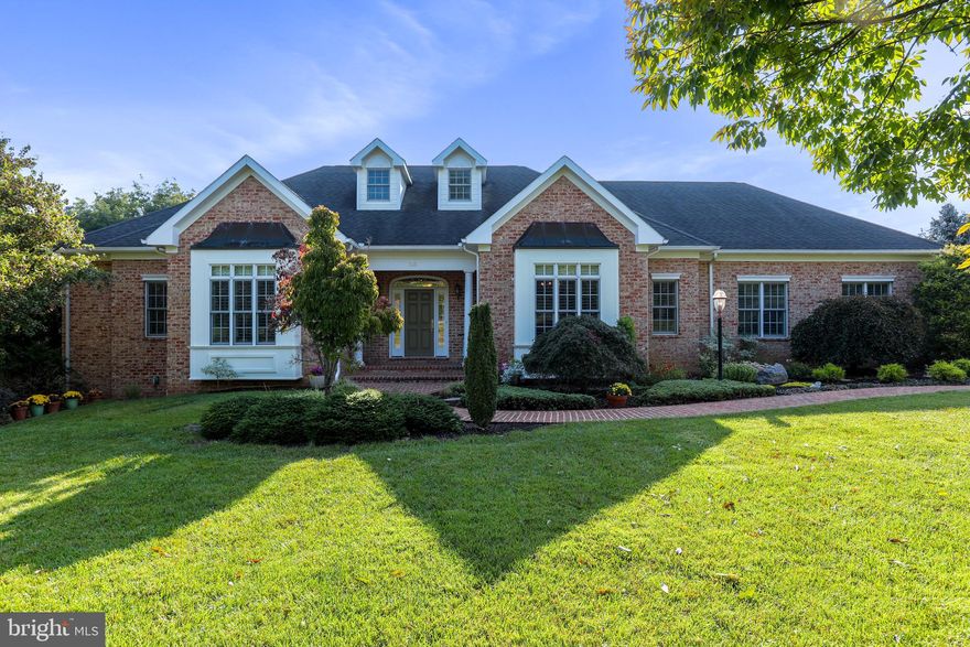 This custom-built 3 bedroom rancher boasts an all-brick exterior, an oversized 2-car garage, extensive hardscaping, and a design that takes advantage of the picturesque golf course views.  Situated along the 7th fairway, the stately home has a distinct look with mature landscaping and rock outcroppings that accentuate its character.  The presentation inside is equally striking with modern elegance and luxurious finishes in every space.  

The contemporary floor plan features an open great room with vaulted ceilings that centers around  one of three Mendota propane fireplaces in the home.  The kitchen is packed full of high-end appliances and features including a cabinet-faced Subzero refrigerator and Miele dishwasher, solid wood cabinetry and granite countertop, an induction cooktop, and a walk-in pantry.  It is adjoined by a breakfast nook that connects to a grilling deck that overlooks the fairway, and by a large dining room that is great for hosting at the cherry wood wet bar with views of the 2nd fairway.  However, privacy awaits in the closed study that features the second fireplace and also in the primary bedroom or largest en suite bathroom with its custom-fitted shower, upgraded vanity, and stylish design.  The primary bedroom and great room connect to the screened-deck with its own exceptional views of the Cress Creek golf course.  

The other two above-grade en suite bedrooms are found in the lower level of the home with the functionality of an in-law suite that includes a large family room centered around the third fireplace, plus a dining space that pairs with a kitchenette that has a sink and small refrigerator.  Both bedrooms feature a large bump out for a sitting area with windows that view into the back yard.  With ample daylighting on both floors and a level walkout to a private brick patio, the home provides a flexible layout that can accommodate many lifestyles.  Separate memberships are available for golf, tennis, swimming, and social activities.