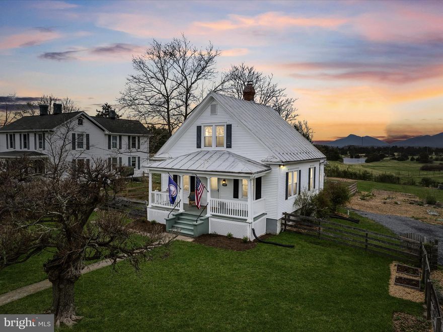 MULTIPLE OFFERS... DEADLINE TUESDAY APRIL 8, 6 PM!  Thank you!
Charming Historic Home with Stunning Blue Ridge Views

Welcome to this beautifully maintained, warm and inviting historic home—a perfect blend of character, comfort, and breathtaking scenery. Nestled on a half-acre lot, you'll wake up each morning to sweeping views of the Blue Ridge Mountains.

The picket-fenced front yard welcomes you to a cozy covered porch, the perfect spot to enjoy your morning coffee. Step inside to discover original hardwood floors, thoughtfully refinished in 2022, and classic architectural details throughout. The sunlit dining room features built-in glass-front cabinets, while the charming breakfast nook off the kitchen adds a cozy, cottage feel.

 The spacious kitchen offers plenty of room for meal prep and entertaining, whether you're serving in the charming breakfast nook, the traditional dining room, or hosting guests. It also features a new Bosch dishwasher (2023). The LG washer and dryer (2023) are conveniently located just off the kitchen. A main-level bedroom and full bath provide flexibility and ease of living, while the upper level offers two additional bedrooms, a second full bath, and surprisingly spacious closets in each room.

An unfinished basement with exterior access offers plenty of storage space.

The backyard is stunning and truly shines—a gardener’s dream! Enjoy the bounty of organic black raspberries, raspberries, strawberries, a peach tree, elderberry tree, and a black currant bush, all nurtured without chemicals. The fully-fenced backyard is perfect for kids and pets. Recent updates include a new  fence (2023), gravel driveway (2023), and a new septic system (2023)—adding peace of mind and value.

This one-of-a-kind home is full of charm, lovingly cared for, and ready for its next chapter. Don’t miss this rare opportunity to own a piece of history with modern comforts and unmatched views.