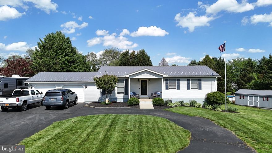 Welcome to 140 Red Pump Rd — a beautifully maintained and thoughtfully upgraded home nestled on 1.55 peaceful acres just beyond the heart of Rising Sun, Maryland, and located within the highly sought-after Rising Sun School District. From the moment you arrive, you’ll feel the privacy and charm of this property, set across from rolling farmland with unforgettable sunset views. Inside, the main level features 3 spacious bedrooms and 2 full bathrooms, an inviting living room, a formal dining space, and an updated kitchen that effortlessly blends function and style. Downstairs, a partially finished walkout basement offers a large, versatile space perfect for entertaining, a game room, or cozy movie nights. Outside is where this home truly shines — your own backyard oasis awaits, complete with a tree-lined yard, a large above-ground pool with expansive decking, two storage sheds, and a huge back deck ideal for relaxing or hosting under the stars. The generous front yard features a circular driveway with ample parking, and a convenient side pad next to the garage is perfectly set up for your camper, trailer, or boat. This home has been extensively updated over the years: new carpet, kitchen flooring, dishwasher, and ceiling fans (2024); a refreshed bathroom (2023); new water heater (2022); well tank (2021); and a metal roof, gutters, and downspouts (2019). The HVAC system, pool deck, and rear deck were also added in 2019, the above-ground pool in 2018, and both the septic system (2014) and well pump (2015) have been replaced. Every inch of this home reflects pride of ownership and care. If you're looking for peace, privacy, and modern comfort — all just minutes from Rising Sun — this is the one you've been waiting for. Don’t miss it!