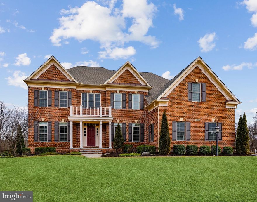 Discerning homebuyers seeking an incomparable setting will immediately end their search at the door of this truly exceptional property sited on a premium level lot with mature trees backing to preserve. An open door grants entry to a spacious bright and airy world with soaring ceilings, gleaming hardwood floors, a custom curved staircase, and moldings that emphasize expert craftsmanship on every level. The main level features an elegant formal dining room with crown molding, chair rail, shadow boxes, and the convenience of a butler’s pantry. Designed for today’s lifestyle, the gourmet kitchen boasts an 8.5-foot granite island with generous seating, large walk-in pantry, and breakfast area with a custom picture window as a resplendent focal point.
The two-story family room displays a dramatic floor-to-ceiling stack-stone double-sided fireplace flanked by a palladium-capped window wall. The sunroom - your private sanctuary, on the other side of the fireplace, displays three walls of windows. French doors with overhead transoms open to a bright office space and a short hall leads to an en suite guest bedroom. The owner's suite transcends the ordinary and features: a wall of windows, trey ceiling, three-piece crown molding, cove lighting, ceiling fan, expansive walk-in closets with built-ins, spa-like owner’s bathroom with soaking tub, oversize two-person shower with multiple shower heads, handheld fixture, and dual sinks. The upper level features a spacious laundry room, linen closet, and three amply sized bedrooms with closet systems and two full baths. A recreation haven awaits in the fully finished walkout lower level offering a home theatre area, high-top seating, beverage center, exercise, recreation areas, and a guest suite with a walk-in closet and full bath. 
Available for a short time, this home has everything and more.