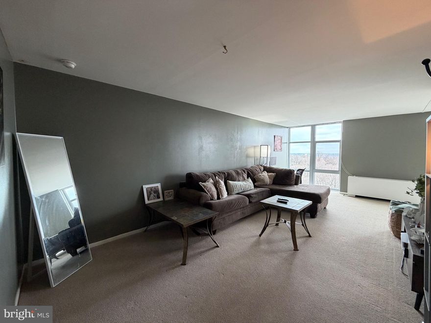 Live above the treetops at River Park House, where comfort meets convenience in this newly painted, spacious 17th Floor, 1-Bedroom, 1-Bath condo! Enjoy breathtaking views of the Philadelphia skyline from your private balcony, overlooking the endless greenery of Fairmount Park stretching toward Center City.
This beautifully maintained condo features floor-to-ceiling windows throughout, filling the space with abundant natural light. The living area includes custom built-in bookcases and fresh, updated paint, with rich tones accent walls that add warmth and style. The hallway provides even more storage with organized closets featuring shelves, cubbies, and laundry bins. The updated galley kitchen is equipped with quartz countertops, a marble backsplash, gas stovetop, refrigerator, dishwasher, under mount sink, track lighting, under-cabinet LED lighting, and durable waterproof plank flooring. The generously sized bedroom offers new flooring, two spacious closets and more floor-to-ceiling windows, creating a bright and relaxing retreat.  The serene white bathroom showcases decorative glass tile accents, ceramic tile flooring, a raised vanity and  a stackable washer and dryer!
Residents of River Park House enjoy a secure, gated community with 24/7 security and doormen. Ideally located near I-76, Route 1, and Kelly Drive, the building offers easy access to Manayunk, Center City, and Philadelphia International Airport. Outdoor enthusiasts will appreciate being just half a mile from the scenic Schuylkill River Trail, perfect for walking and biking.
The monthly condo fee covers all utilities—gas, water, electricity, sewer, heating, air conditioning, trash removal, and Verizon basic cable,  Along with building maintenance, a basement storage locker and parking around the building (with optional assigned garage parking available for an additional fee). A fitness center and outdoor swimming pool are also available!
On-site conveniences include a cafe, dry cleaners, and law office!  The bus stop is directly across the street and quick access to major attractions!  This condo offers the perfect balance of tranquility and urban accessibility.
Schedule your showing today and experience elevated city living at its finest!