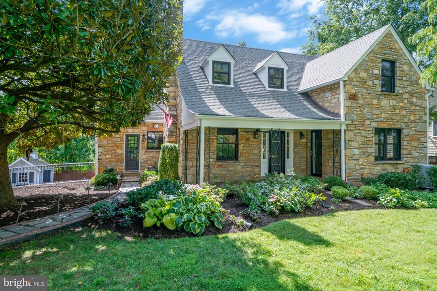 Built in 1941, this gorgeous renovated cape cod is sited on a large private lot in a desirable Arlington neighborhood.  The lovely sloped roof and covered front porch are highlights of the beautiful curb appeal.  An open concept main level is juxtaposed with charming original features.  The spacious living room includes a wood burning fireplace and just beyond is the formal dining area with an original built-in china cabinet.  A glass door from the dining room leads to a spectacular balcony with a canopy of Wisteria overlooking the back yard.  The kitchen is a chef’s delight with a gas range, stainless steel appliances, dining area, an abundance of counter space, cabinet storage, and a walk-in pantry.  There are two sizable main level bedrooms, one with access to the front porch making it a cheerful office work space.  The main level full bath has been renovated and is conveniently located.  The hallmark of the upper-level primary suite is the spa-like en suite bath and extra-large walk-in closet.  Two additional bedrooms and a full bath complete this level.  The lower level offers a sweeping reaction room, laundry, storage, a half bath and access to the 2-car garage.  The expansive fenced backyard offers lush plantings, green grass, a separate space for a vegetable garden, a covered stone patio and a charming shed.  With 9’ ceilings, hardwood floors, new HVAC, new windows and many more upgrades this exceptional home is move-in ready!  It is ideally located with easy access to I-66, George Washington Parkway, Reagan National Airport, Amazon HQ and Washington, DC.
