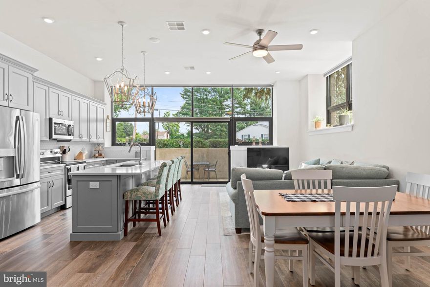 A luxury condo with low maintenance living all in one package! Unit A-107 is a custom-designed garden-level home featuring single-level living plus a private enclosed patio. As you enter the home, you are greeted with a beautiful oversized foyer with storage closets and access to an in-home office. The entryway leads to the open concept kitchen, dining, and living space. The building itself is an old school converted into luxury condos, and you will see touches of this throughout the home - exposed original brick, old repurposed doors, chalkboards, and more! Just off of the main living space is the primary suite, complete with a large walk-in closet and full bathroom. The second bedroom feels like another primary suite, equipped with it's own private full bathroom as well. This is one of only a few units with a private outdoor space, an enclosed patio off of the main living space and kitchen. Your own private sanctuary beneath the trees! In addition to the space provided in-home, this condo also comes with a dedicated 5x7 storage unit for your extra belongings. Outside of your home, the StoneSchool community has so much to offer! An outdoor community space with grills and a fire pit, walking trail, fitness center, D.I.Y. workshop room, community/party room, landscaped grounds, dog park, and covered parking. Unit A-107 comes with 2 parking spaces - one in a covered carport and another in the general parking lot. One of the parking spaces also comes upgraded with an electric charging station - a bonus feature that the owners added. This low-maintenance living community is within walking distance of local stores and restaurants, and is just a short drive to Route 422 and the Providence Town Center. ***Please contact listing agent for additional HOA information***