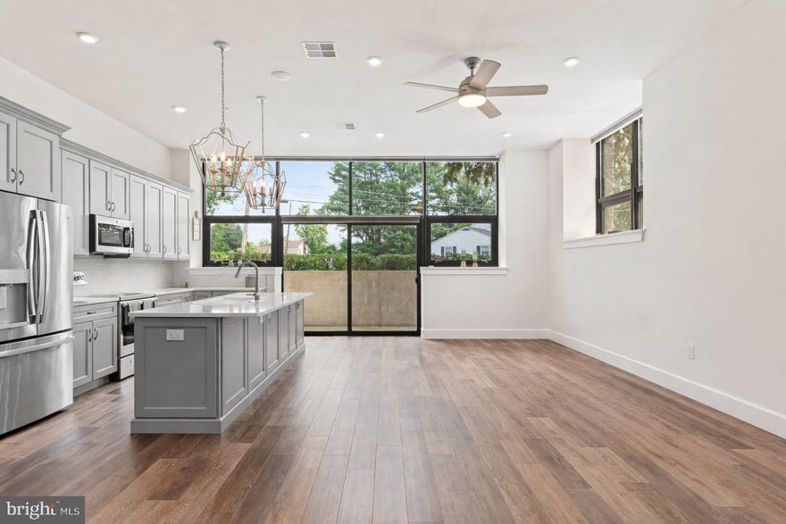 ***INCENTIVE: This home is eligible for an exclusive mortgage offer: 1% OFF buyer's rate for ONE FULL YEAR!*** A luxury condo with low maintenance living all in one package! Unit A-107 is a custom-designed garden-level home featuring single-level living plus a private enclosed patio. As you enter the home, you are greeted with a beautiful oversized foyer with storage closets and access to an in-home office. The entryway leads to the open concept kitchen, dining, and living space. The building itself is an old school converted into luxury condos, and you will see touches of this throughout the home - exposed original brick, old repurposed doors, chalkboards, and more! Just off of the main living space is the primary suite, complete with a large walk-in closet and full bathroom. The second bedroom feels like another primary suite, equipped with it's own private full bathroom as well. This is one of only a few units with a private outdoor space, an enclosed patio off of the main living space and kitchen. Your own private sanctuary beneath the trees! In addition to the space provided in-home, this condo also comes with a dedicated 5x7 storage unit for your extra belongings. Outside of your home, the StoneSchool community has so much to offer! An outdoor community space with grills and a fire pit, walking trail, fitness center, D.I.Y. workshop room, community/party room, landscaped grounds, dog park, and covered parking. Unit A-107 comes with 2 parking spaces - one in a covered carport and another in the general parking lot. One of the parking spaces also comes upgraded with an electric charging station - a bonus feature that the owners added. This low-maintenance living community is within walking distance of local stores and restaurants, and is just a short drive to Route 422 and the Providence Town Center. ***Please contact listing agent for additional HOA information***