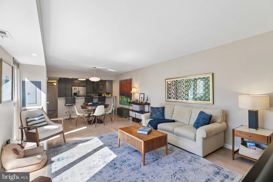 Bright and beautifully appointed bi-level condominium in the highly sought-after Penn’s Landing Square community in Society Hill, offering a seamless blend of modern design, light-filled interiors, and exceptional private outdoor living.
Nestled within lushly landscaped courtyards and a tranquil, garden-style setting, the home is introduced through a private entry and foyer before ascending to an expansive open-concept living and dining level. Rich flooring, recessed lighting, and oversized windows frame serene courtyard and pool views with a dramatic city skyline backdrop, creating an airy yet refined main living space well-suited for both everyday living and entertaining.
The stainless steel kitchen is thoughtfully designed with gray cabinetry, marble countertops, and a crisp white subway tile backsplash. Unlike many residences in the community, this kitchen is fully open to the dining area and includes a breakfast counter, enhancing flow and functionality while creating a true social layout. A conveniently located powder room completes this level.
Upstairs, the primary suite offers a bright and generously scaled retreat, easily accommodating a king-sized bed along with a sitting or reading area. The updated bathroom features a clean, modern aesthetic with a sleek white vanity and a separate bath and shower layout for added comfort and privacy. A hallway laundry closet with stacked washer and dryer adds everyday convenience to the bedroom level.
The second bedroom is exceptionally spacious and opens through sliding glass doors to a private deck—an outstanding outdoor extension of the home. This rare retreat includes skyline views, a covered storage area, and ample space for dining, lounging, or enjoying morning coffee and summer fireworks.
Residents of Penn’s Landing Square enjoy a quiet, gated community atmosphere with a recently renovated swimming pool, beautifully maintained grounds, and a true sense of urban oasis living. Just moments away is the historic and highly walkable Old City district, known for its vibrant dining scene, independent art galleries, and cultural energy, along with waterfront recreation along the Delaware River Trail.
Nearby highlights include acclaimed restaurants such as Zahav and Bloomsday, as well as Headhouse Square Farmers Market and the broader Society Hill historic district.
Blending privacy, convenience, and lifestyle amenities in one of Society Hill’s most distinctive communities, this home offers an elevated city living experience with rare outdoor space, resort-style surroundings, and Garage Parking.