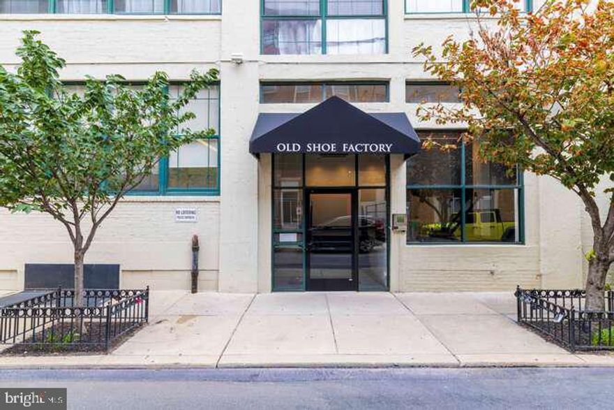 Once a bustling shoe factory, now a sleek modern residence, 314 N 12th St #1004 rises above Philly’s vibrant Callowhill neighborhood as a one-of-a-kind penthouse loft. This 1-bed, 1-bath home is all about spectacular views—soaring ceilings and massive windows flood the space with light while framing jaw-dropping panoramas of the city skyline.  Wide-plank hardwoods and exposed brick set the stage for dramatic, open-concept living. Whether you’re lounging by the fireplace or hosting dinner under the glittering city lights, every corner of the main level is designed to impress. The sleek white kitchen, complete with stainless steel appliances, a tile backsplash, and an oversized island, makes entertaining effortless.  The elevated bedroom enjoys abundant natural light and double closets, while the spacious bathroom offers a wide vanity, generous storage, and an in-unit laundry closet for convenience.
And it doesn’t stop inside—the building’s unbeatable location boasts a Walk Score of 97! Step outside and you’re minutes from Trader Joe’s, Reading Terminal Market, Franklin Square, Love Park, and endless restaurants, shops, and entertainment. With easy access to Center City, Broad St, I-676, I-95, and South Jersey, everything you need is right at your doorstep.
Showings begin Thursday, 9/11—come see the city views that will take your breath away!