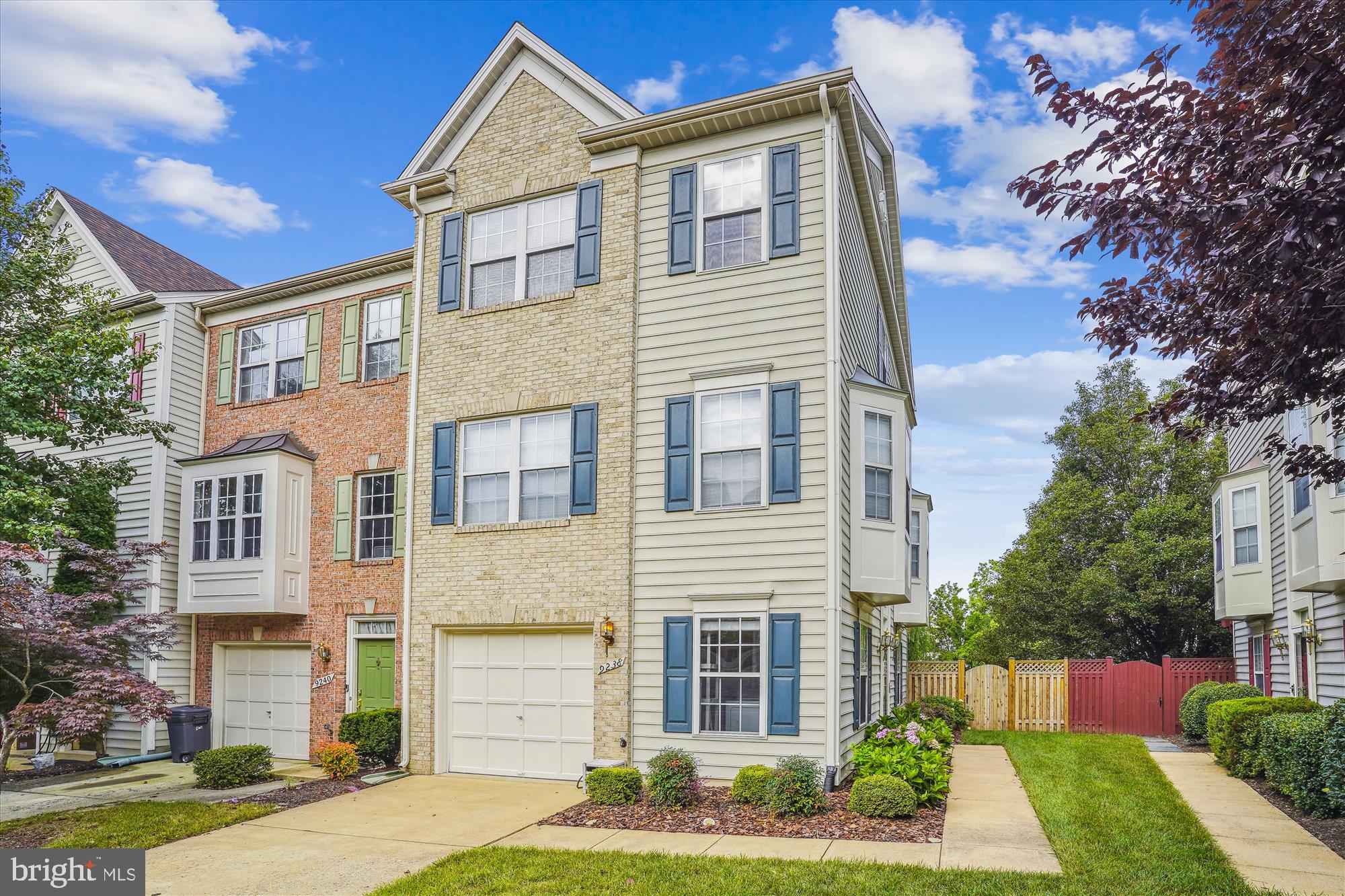 Enjoy lots of natural light from the third wall of windows in this move-in ready, freshly painted and carpeted, three (3) bedroom, 2 full bath, 2 half bath garage end unit with deck in Gunston Corner Townhomes (Lorton, VA) close to Fort Belvoir. Find main level cherry wood floors and 8 new dimmable recessed lights in the living room. The wood floors continue in the kitchen and dining area. Stainless steel appliances including a quiet dishwasher, quartz counters, recessed lights, a ceiling fan with light and remote control, and a chandelier finish the kitchen. The owner's bedroom includes a walk-in closet and an ensuite bath with a jetted tub. Another full bathroom serves the two secondary bedrooms. Find two updated half baths, one one each lower floor featuring updated flooring, vanities, efficient commodes and lights. All bedrooms have a ceiling fan with light and remotes. Close to Ft Belvoir/Belvoir North. Relatively close and reverse commute to Quantico Marine Corps Base. Relatively close to the Pentagon, Andrews AFB and Joint Base Bolling. Commuter bus one block away. Virginia Railway Express (VRE) station approximately two miles away. Springfield Metro is seven (7) miles away. Find a variety of restaurants in the local area and a broader selection within 7 miles. Grocery shop at the new Amazon Fresh about a mile away and the Lidl under construction about a half mile away. Giant Foods is in Lorton Valley Shopping Center.