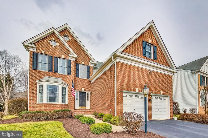 OPEN HOUSE CANCELLED, home under contract. Gated golf community Dominion Valley Country Club offers this loaded Mount Vernon Model on a quiet cul de sac street in desired part of the community. Close walk to  community pools, tennis, basketball courts, tot lots, and riding trails! This efficient and popular  floorpan offers ample spaces for entertaining and your growing family. Professional designer has executed detailed millwork and tile work throughout main. Some features include hardwood flooring, gourmet kitchen with newer appliances, separate living and dining rooms, and open and bright family room. Exterior hardscape features stamped concrete patio, elegant water feature and privacy.  Fully finished basement with bedroom, fitness room, full bathroom and plenty of room for enjoying entertainment. Upper level boasts huge primary suite and multiple closet spaces with built in shelving units. Secondary bedroom offers extra attached full bathroom. Extended garage spaces promote storage for all of your families recreational items. Make this one a must see for your family! Gated golf community offers memberships, close to shopping, schools and commuter routes.