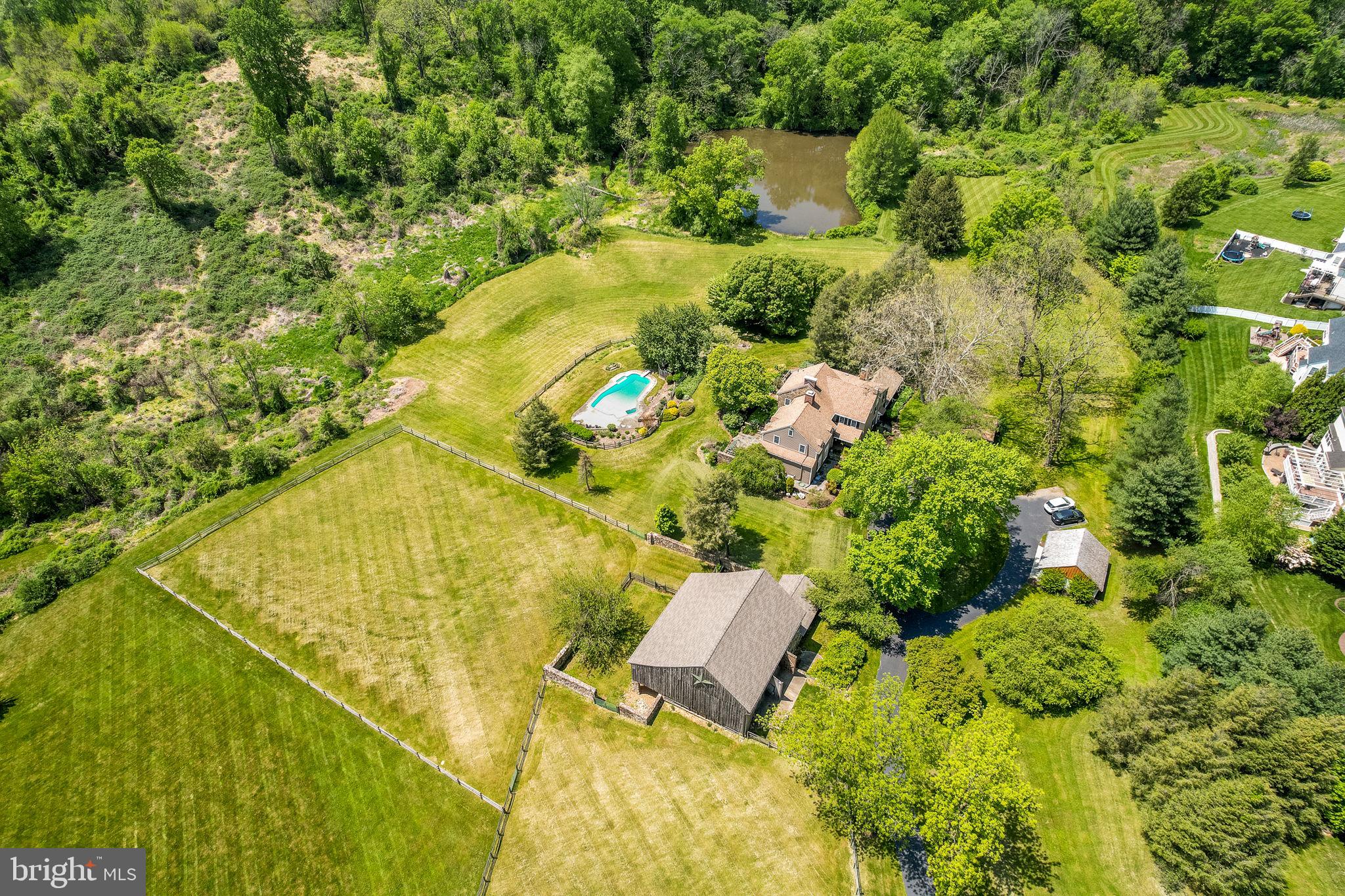 Welcome to Penn Hollow, a stunning historic manor located at 173 Candlewyck Dr. in Avondale, PA. This move-in-ready property offers luxurious living with all the charm and character of a European farmhouse.
With 5 bedrooms and 4.1 bathrooms spread over 5,284 Sq Ft, this property offers plenty of space that can be easily configured for families of all sizes. The chef’s eat-in kitchen is a dream come true for any culinary enthusiast, complete with modern appliances and gorgeous finishes. The 5 working fireplaces throughout the home create a cozy and inviting atmosphere that is perfect for entertaining guests.
One of the standout features of this property is the primary bedroom en-suite, which boasts tons of natural light, spectacular pastured views, three closets, and a unique bathroom highlighted by a stone wall, heated floor and a grand shower. This luxurious space also features a private staircase to the main level, providing a perfect blend of privacy and convenience.
In addition to the stunning main residence, Penn Hollow also features a multi-level, multi-stall barn, two detached garages, and 5.83 acres of land with three lush fenced pastures. This property is perfect for equestrian enthusiasts or those looking for plenty of space for outdoor activities.
Penn Hollow is also equipped with all the modern amenities you could need, including central A/C, an in-ground pool, and public water & public sewer. Its location is unbeatable - nestled next to a friendly neighborhood, yet just a short drive to shops, restaurants, award-winning Kennett Schools as well as Private Schools in Chester County & in the Wilmington Area.
If you're looking for a unique and luxurious property that offers all the amenities of modern living while still maintaining its historic charm, Penn Hollow is the perfect choice. Come see it for yourself and experience the tranquility and beauty of this one-of-a-kind estate. (See video in MLS for 3-D Virtual Tour and Floor Plan)