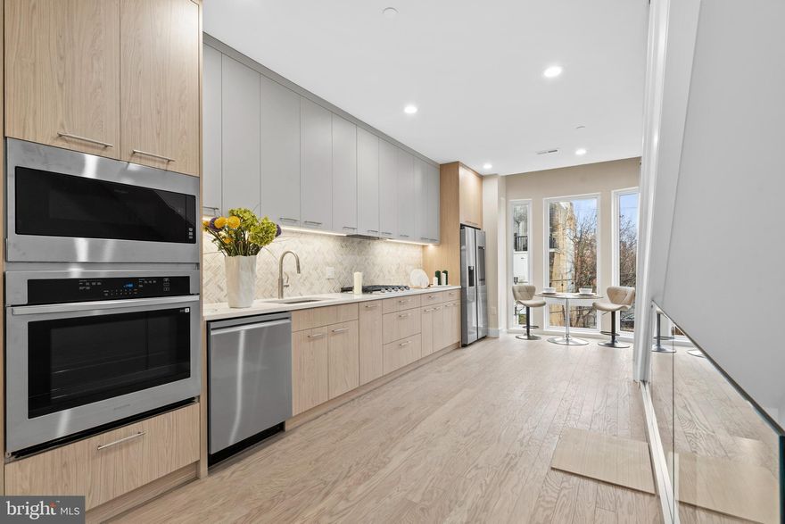 Welcome to 1031 S Fairhill Street, a stunning 3-story new construction **FULLY 10 YEAR TAX ABATED (2021 version)** in Queen Village offering thoughtfully designed living space. With sophisticated finishes, a rare community garden view, and modern smart-home features, this residence perfectly balances comfort and style. The lower level features a versatile bedroom with a full bathroom, ideal as a private suite, home office, or media room. The first level greets you with a flexible entry space, leading to the second bedroom with its own bathroom dividing the two spaces that can adapt to your lifestyle needs. The second level is the heart of the home - an airy open-concept floor with living, dining, and kitchen seamlessly flowing together. Anchored by floor-to-ceiling windows and east-west exposure, natural light fills every corner. The chef’s kitchen with granite countertops, premium appliances, and sleek cabinetry sits alongside the dining area framed by a bay window overlooking a city garden. This unique vantage point brings in rare greenery and a sense of openness seldom found in city living. The third level is reserved for the primary suite, featuring a spa-like bathroom with heated floors, a walk-in closet with custom built-ins, and a private balcony with serene city views. Enjoy multiple outdoor escapes, from the concrete-paved backyard with street easement access to the expansive rooftop decks panoramic skyline views - perfect for entertaining or relaxing at sunset. This home is also enhanced with integrated smart-home technology, including security cameras, locks, and thermostats that can all be controlled with a swipe of your finger. Don't forget about the gas heating, a gas dryer, tall ceilings, and engineered hardwood floors, and this home truly checks every box. The home is being finished and will be substantially completed prior to settlement offering the opportunity for a buyer make modifications to the kitchen, countertop colors, flooring, tile work, hardware color and more!