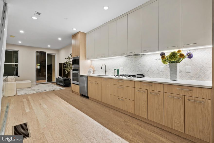 Welcome to 1031 S Fairhill Street, a stunning 3-story new construction with an **Estimated $80,000 tax savings over the course of the rarely offered FULL 10 year tax abatement** in Queen Village offering thoughtfully designed living space. With sophisticated finishes, a rare community garden view, and modern smart-home features, this residence perfectly balances comfort and style. The lower level features a versatile bedroom with a full bathroom, ideal as a private suite, home office, or media room. The first level greets you with a flexible entry space, leading to the second bedroom with its own bathroom dividing the two spaces that can adapt to your lifestyle needs. The second level is the heart of the home - an airy open-concept floor with living, dining, and kitchen seamlessly flowing together. Anchored by floor-to-ceiling windows and east-west exposure, natural light fills every corner. The chef’s kitchen with granite countertops, premium appliances, and sleek cabinetry sits alongside the dining area framed by a bay window overlooking a city garden. This unique vantage point brings in rare greenery and a sense of openness seldom found in city living. The third level is reserved for the primary suite, featuring a spa-like bathroom with heated floors, a walk-in closet with custom built-ins, and a private balcony with serene city views. Enjoy multiple outdoor escapes, from the concrete-paved backyard with street easement access to the expansive rooftop decks panoramic skyline views - perfect for entertaining or relaxing at sunset. This home is also enhanced with integrated smart-home technology, including security cameras, locks, and thermostats that can all be controlled with a swipe of your finger. Don't forget about the gas heating, a gas dryer, tall ceilings, and engineered hardwood floors, and this home truly checks every box. The home is being finished and will be substantially completed prior to settlement offering the opportunity for a buyer make modifications to the kitchen, countertop colors, flooring, tile work, hardware color and more!