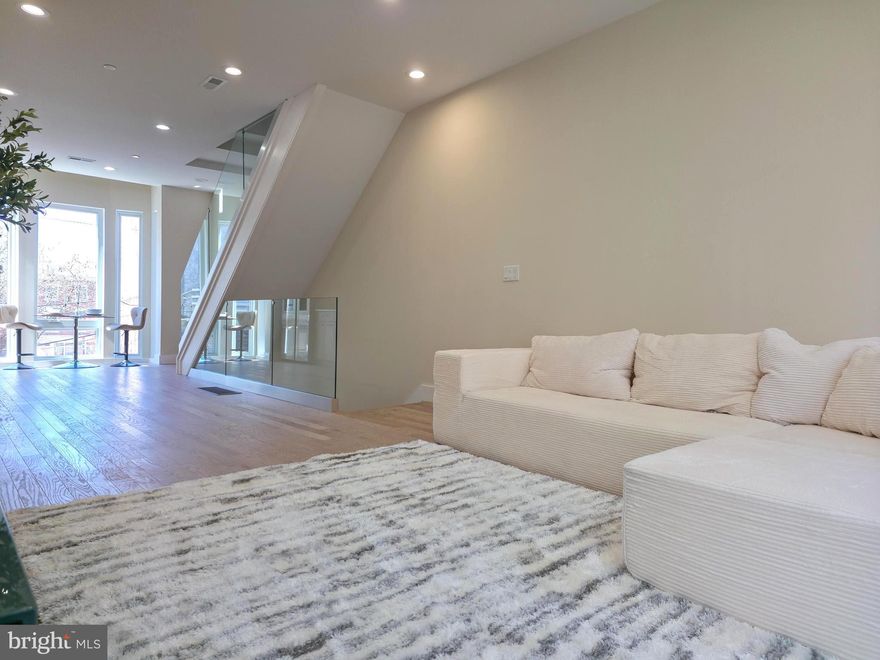 Welcome to 1031 S Fairhill Street, a stunning 3-story new construction with an **Estimated $80,000 tax savings over the course of the rarely offered FULL 10 year tax abatement** in Queen Village offering thoughtfully designed living space. With sophisticated finishes, a rare community garden view, and modern smart-home features, this residence perfectly balances comfort and style. The lower level features a versatile bedroom with a full bathroom, ideal as a private suite, home office, or media room. The first level greets you with a flexible entry space, leading to the second bedroom with its own bathroom dividing the two spaces that can adapt to your lifestyle needs. The second level is the heart of the home - an airy open-concept floor with living, dining, and kitchen seamlessly flowing together. Anchored by floor-to-ceiling windows and east-west exposure, natural light fills every corner. The chef’s kitchen with granite countertops, premium appliances, and sleek cabinetry sits alongside the dining area framed by a bay window overlooking a city garden. This unique vantage point brings in rare greenery and a sense of openness seldom found in city living. The third level is reserved for the primary suite, featuring a spa-like bathroom with heated floors, a walk-in closet with custom built-ins, and a private balcony with serene city views. Enjoy multiple outdoor escapes, from the concrete-paved backyard with street easement access to the expansive rooftop decks panoramic skyline views - perfect for entertaining or relaxing at sunset. This home is also enhanced with integrated smart-home technology, including security cameras, locks, and thermostats that can all be controlled with a swipe of your finger. Don't forget about the gas heating, a gas dryer, tall ceilings, and engineered hardwood floors, and this home truly checks every box. The home is being finished and will be substantially completed prior to settlement offering the opportunity for a buyer make modifications to the kitchen, countertop colors, flooring, tile work, hardware color and more!