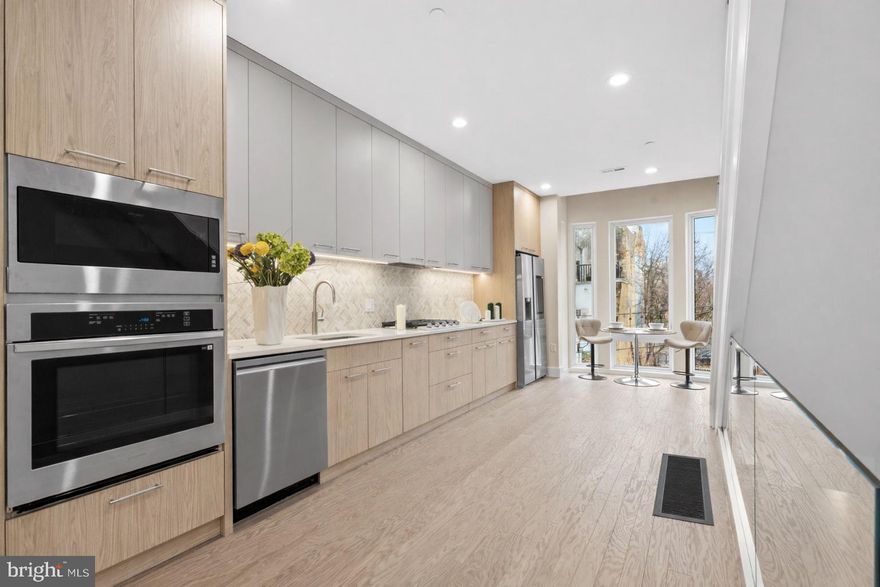 Welcome to 1031 S Fairhill Street, a stunning 3-story new construction **FULLY 10 YEAR TAX ABATED (2021 version)** in Queen Village offering thoughtfully designed living space. With sophisticated finishes, a rare community garden view, and modern smart-home features, this residence perfectly balances comfort and style. The lower level features a versatile bedroom with a full bathroom, ideal as a private suite, home office, or media room. The first level greets you with a flexible entry space, leading to the second bedroom with its own bathroom dividing the two spaces that can adapt to your lifestyle needs. The second level is the heart of the home - an airy open-concept floor with living, dining, and kitchen seamlessly flowing together. Anchored by floor-to-ceiling windows and east-west exposure, natural light fills every corner. The chef’s kitchen with granite countertops, premium appliances, and sleek cabinetry sits alongside the dining area framed by a bay window overlooking a city garden. This unique vantage point brings in rare greenery and a sense of openness seldom found in city living. The third level is reserved for the primary suite, featuring a spa-like bathroom with heated floors, a walk-in closet with custom built-ins, and a private balcony with serene city views. Enjoy multiple outdoor escapes, from the concrete-paved backyard with street easement access to the expansive rooftop decks panoramic skyline views - perfect for entertaining or relaxing at sunset. This home is also enhanced with integrated smart-home technology, including security cameras, locks, and thermostats that can all be controlled with a swipe of your finger. Don't forget about the gas heating, a gas dryer, tall ceilings, and engineered hardwood floors, and this home truly checks every box. The home is being finished and will be substantially completed prior to settlement offering the opportunity for a buyer make modifications to the kitchen, countertop colors, flooring, tile work, hardware color and more!