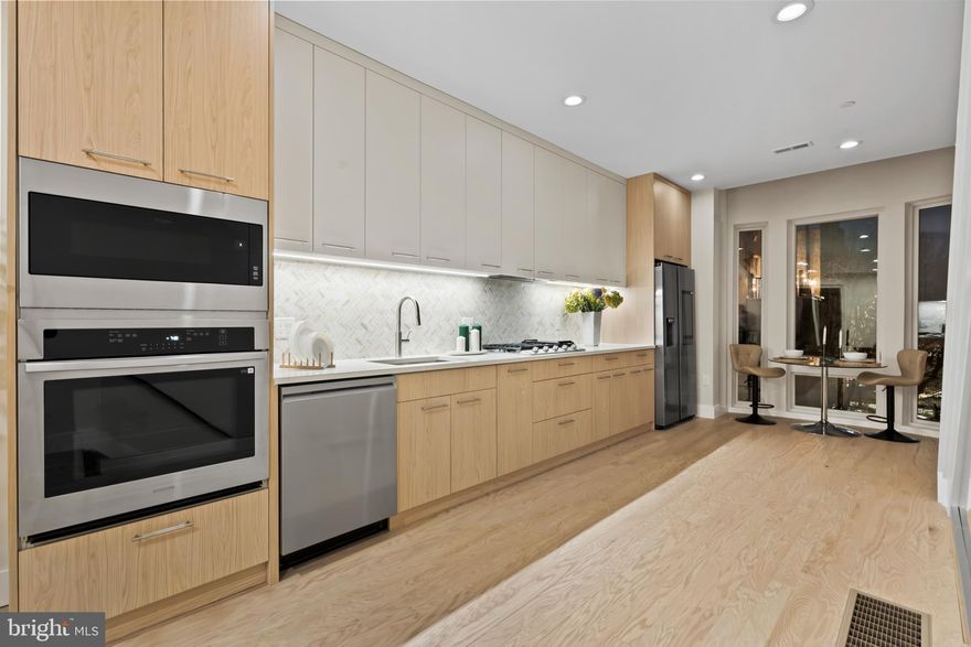 Welcome to 1031 S Fairhill Street, a stunning 3-story new construction with an **Estimated $80,000 tax savings over the course of the rarely offered FULL 10 year tax abatement** in Queen Village offering thoughtfully designed living space. With sophisticated finishes, a rare community garden view, and modern smart-home features, this residence perfectly balances comfort and style. The lower level features a versatile bedroom with a full bathroom, ideal as a private suite, home office, or media room. The first level greets you with a flexible entry space, leading to the second bedroom with its own bathroom dividing the two spaces that can adapt to your lifestyle needs. The second level is the heart of the home - an airy open-concept floor with living, dining, and kitchen seamlessly flowing together. Anchored by floor-to-ceiling windows and east-west exposure, natural light fills every corner. The chef’s kitchen with granite countertops, premium appliances, and sleek cabinetry sits alongside the dining area framed by a bay window overlooking a city garden. This unique vantage point brings in rare greenery and a sense of openness seldom found in city living. The third level is reserved for the primary suite, featuring a spa-like bathroom with heated floors, a walk-in closet with custom built-ins, and a private balcony with serene city views. Enjoy multiple outdoor escapes, from the concrete-paved backyard with street easement access to the expansive rooftop decks panoramic skyline views - perfect for entertaining or relaxing at sunset. This home is also enhanced with integrated smart-home technology, including security cameras, locks, and thermostats that can all be controlled with a swipe of your finger. Don't forget about the gas heating, a gas dryer, tall ceilings, and engineered hardwood floors, and this home truly checks every box. The home is being finished and will be substantially completed prior to settlement offering the opportunity for a buyer make modifications to the kitchen, countertop colors, flooring, tile work, hardware color and more!