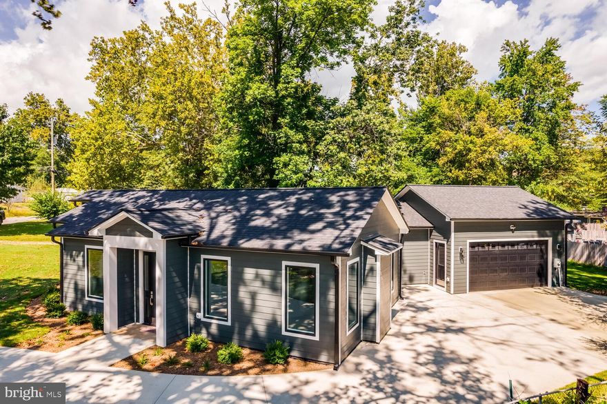 Single Family - One-Level Living at Its Finest!
This stunning brand-new home offers an elegant estate feel with soaring ceilings and oversized Andersen Series 400 windows that fill the space with exceptional natural light. Rich 8 foot solid wood doors, elevate the craftsmanship and add lasting value and sophistication. Featuring three spacious bedrooms and three full baths, this thoughtfully designed residence blends luxury and comfort in perfect harmony. The gourmet kitchen is a true showpiece, showcasing a Frigidaire Professional appliance package, an eye-catching glass island range hood, and designer finishes throughout. A spacious two-car garage adds convenience, all in a prime location just a short walk to the VRE Woodbridge Station, shopping, and dining. Experience the very best in single-level living with high-end style and everyday ease.