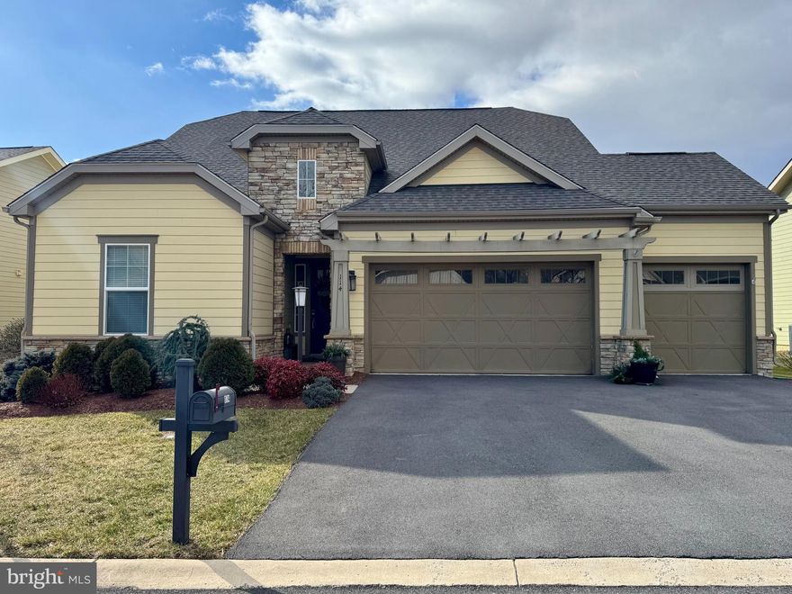 Welcome to 114 Turnstone Lane! Discover the elegance of single-level living in this exceptional three-bedroom, three-and-a-half-bath Elate Model, ideally situated in the prestigious Shenandoah community at Lake Frederick. This impeccably maintained home is designed for effortless living and features a rare 3-car garage, providing ample space for vehicles and additional storage. The heart of the home features an open-concept great room with a sunlit living area and a cozy gas fireplace, a dedicated dining area, and a chef-inspired kitchen anchored by an immense island with seating and a professional 5-burner gas cooktop. Retreat to the luxurious primary suite, which offers a generous walk-in closet, a spa-like bath with tiled walk-in shower, and convenient access to the outdoor porch. Completing the main level are a powder room and laundry room w/sink, as well as a private second bedroom with en suite bath. Designed for entertaining, the lower level features an expanded family room (pre-plumbed for a wet bar), a third bedroom, full bath, and extensive  storage. Experience a Resort Lifestyle: Living here means access to an unparalleled suite of amenities. You are just steps away from:
-An expansive clubhouse featuring indoor and outdoor swimming pools.
-A state-of-the-art exercise room and tennis courts.
-The renowned Regions 117 restaurant for award-winning dining.
-Direct access to Lake Frederick for fishing, canoeing, and kayaking.
-Miles of scenic walking paths and sidewalks throughout the nature-filled community.
Conveniently located near shopping, the Winchester Hospital complex, and major commuter routes, this home offers the perfect balance of luxury and location.