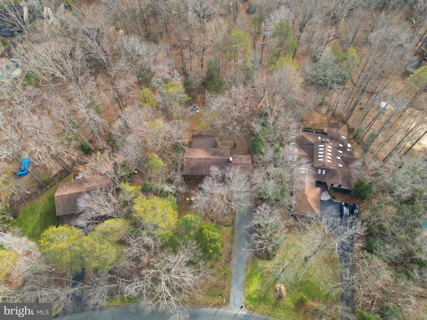 🌳 Living Among the Trees in Occoquan Forest 🌿
Set among mature trees 🌲 and backing to community trails, this spacious 4-bedroom, 3.5-bath home offers a unique opportunity to enjoy privacy, nature, and an active outdoor lifestyle in Occoquan Forest.

The main level features a welcoming living space anchored by a wood-burning fireplace 🔥, while a second fireplace in the walkout basement creates an inviting lower-level area ideal for recreation, hobbies, or gatherings. Generous room sizes and multiple living spaces provide flexibility and a solid foundation for everyday living and entertaining.

Outdoor living is a standout feature. An expansive deck 🌞🌲 overlooking the wooded surroundings offers a peaceful setting for dining or relaxing, while **two outdoor fire pit areas 🔥—one in the front and one in the backyard—**create inviting spaces to gather with friends or enjoy quiet evenings under the trees.

The home offers excellent bones, abundant square footage, and the opportunity to customize and refresh the space to suit your taste and vision ✨.

Occoquan Forest is known for its strong sense of community 🤝 and exceptional amenities. Residents enjoy access to approximately 35 acres of community-owned land, miles of wooded trails 🥾, direct water access to the Occoquan River 🌊, a community dock ⚓ and pavilion, dog park 🐾, and horseshoe pit, along with HOA-sponsored events such as a summer picnic ☀️, Oktoberfest 🍂, and other neighborhood gatherings.

With river access just moments away, the community offers opportunities for boating 🚤, kayaking 🛶, fishing 🎣, and paddleboarding, making it ideal for those who value outdoor recreation and a connection to nature.

This home offers more than just space—it offers a lifestyle defined by nature 🌿, community 🤍, and the freedom to create something truly your own. Some images have been virtually staged to illustrate the home’s potential.