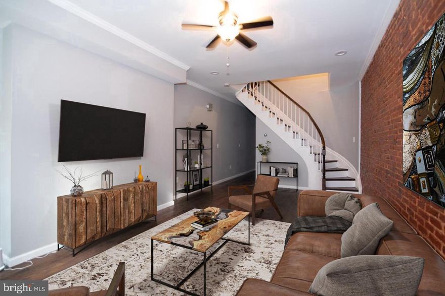 Step into comfort, space, and exceptional value in this stunning home located in the highly desirable Heritage Crossing community of Baltimore City. With approximately 1,830 square feet of thoughtfully designed living space PLUS an additional 600 square feet, this residence offers room to grow, work, and entertain with ease.

Meticulously maintained and move-in ready, the home boasts five generously sized bedrooms and 2.5 bathrooms, perfectly suited for modern living. The main level greets you with a bright, welcoming living room that seamlessly connects to the dining area—ideal for hosting gatherings or enjoying relaxed everyday moments. The stylish kitchen features contemporary finishes and opens directly to a private balcony, creating the perfect spot for morning coffee, evening unwinding, or alfresco dining. A convenient half bath completes this level.

Upstairs, you’ll find three sun-filled bedrooms with ample closet space and a beautifully updated full bathroom. The third level expands your possibilities with two additional bedrooms and a second full bath, making it ideal for guest suites, home offices, creative spaces, or multigenerational living.

The partially finished lower level adds even more flexibility—perfect for a rec room, gym, or bonus living space—along with a utility area featuring a washer and dryer and abundant storage.

Located just minutes from shopping, dining, schools, parks, and major commuter routes, this home delivers the perfect balance of space, convenience, and lifestyle in one of Baltimore City’s most established neighborhoods.

Homes with this much space and versatility don’t come along often—schedule your showing today and make this exceptional property your next home.