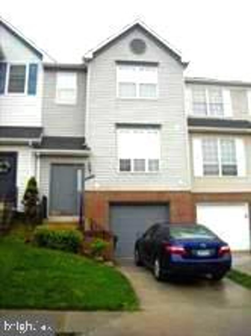 Welcome to this beautiful 3-bedroom, 2 full/2 half bath garage townhome located in the highly sought-after The Courts of Piney Orchard! Step inside to find stunning luxury vinyl plank flooring throughout the main level, creating a modern and cohesive flow. The spacious living room and dining room combination features a cozy woodburning fireplace and a sliding door that opens to a large deck—perfect for entertaining or relaxing outdoors. The large eat-in kitchen boasts sleek black appliances and ample cabinet space. Upstairs, you'll find a generous Primary Bedroom with an adjoining en-suite bath, plus two additional sizeable bedrooms and a full hall bath. The lower level offers a versatile family room with recessed lighting, a convenient half bath, and walk-out access to a patio and fully fenced yard. Freshly painted throughout and featuring brand new six-panel doors, this home is move-in ready and full of charm!