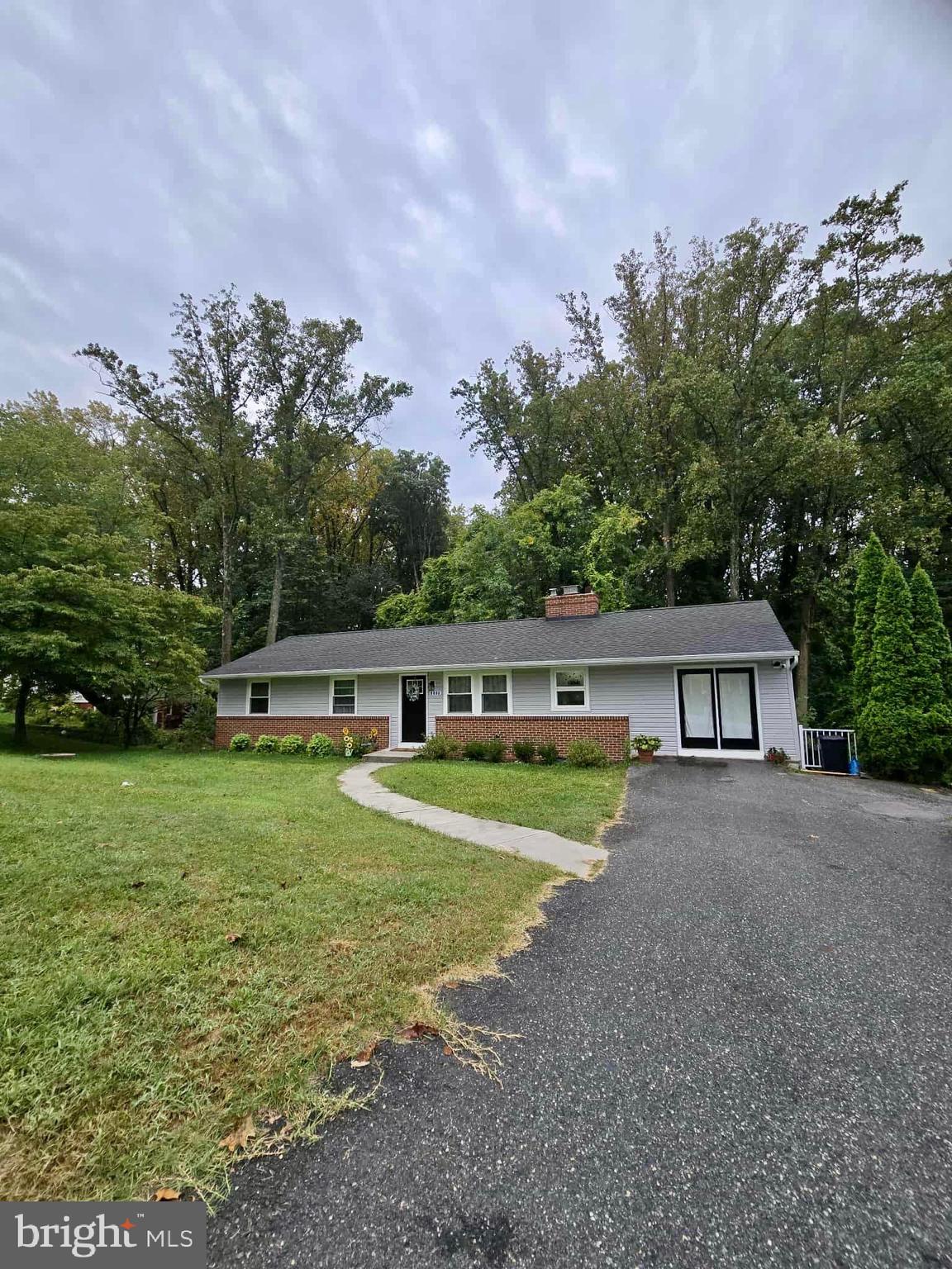 Stunning 5 bedroom, 3 bathroom rancher nestled in a quiet and forested pocket of Parkville. This recently renovated home has all you are looking for, including a gourmet kitchen with quartz countertops, ss appliances, hardwood floors, fireplace, recessed lighting, crown moldings, deck, tons of natural light, plenty of storage and much, much more! This home features a breathtaking and almost surreal view of the woods from the living room. Conveniently located close to supermarkets, gyms, shopping, walking trails and 695 exits. Make an appointment to visit today!