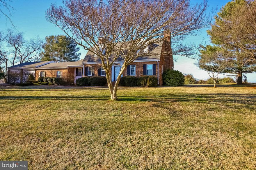 Spacious cape cod style brick home with lots of extra features to offer! Two car garage, well maintained hardwood floors throughout and granite counter tops in the kitchen. Large unfinished basement with plenty of space for storage. A cozy sun room on the back of the home provides spectacular views of rolling hills and the blue ridge mountains, perfect for morning coffee or evening entertaining!