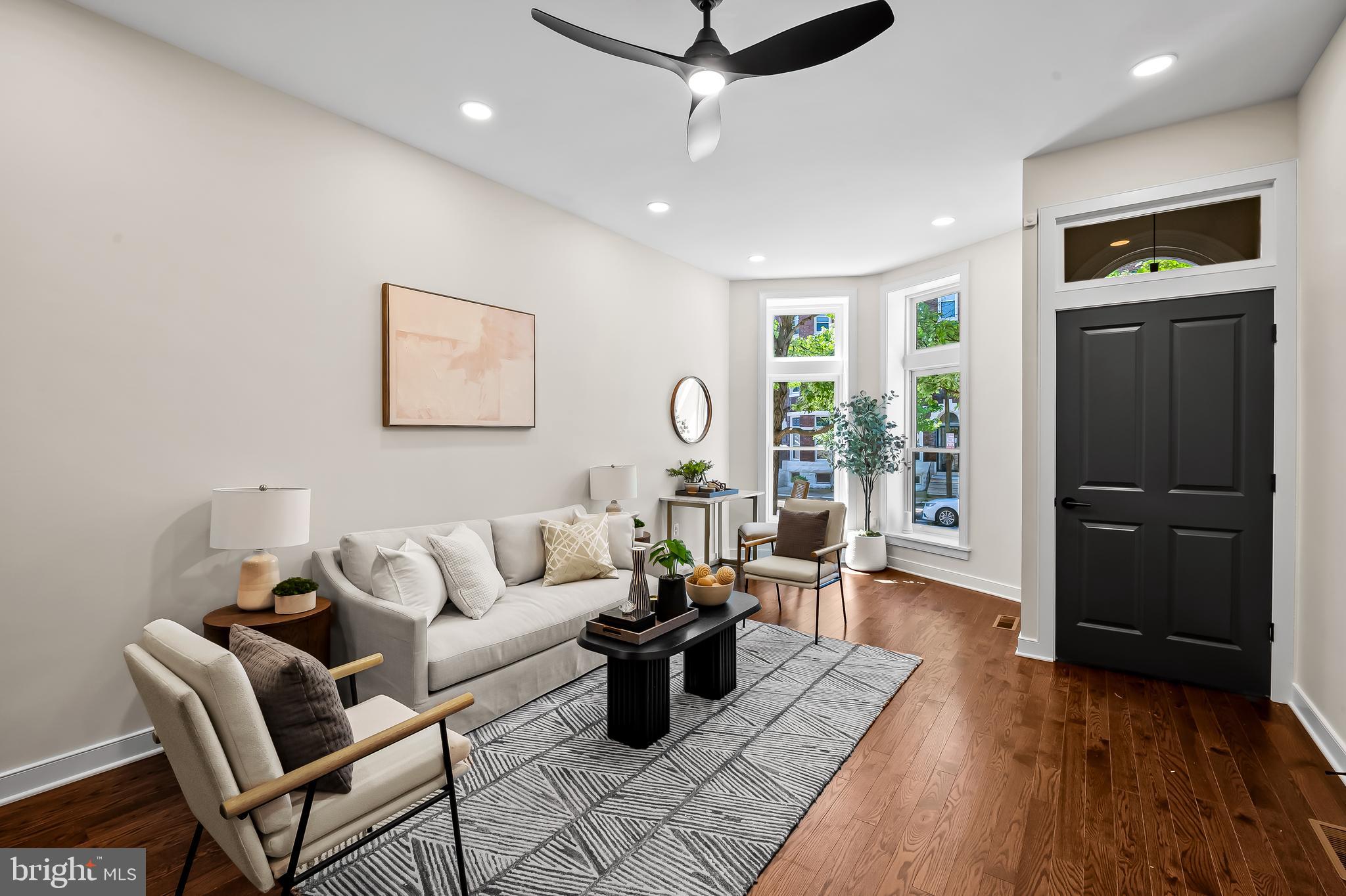 Modern design meets historic charm in the heart of Barclay. This three-bedroom, two-and-a-half bath CHAP Tax Credit renovation is solar-ready and includes a deck, garden, and off-street parking. Significant property tax savings thanks to the pending 10-year CHAP historic tax credit. While priced at $395,000 the significant property tax savings thanks to the pending CHAP historic tax credits will make your payments feel like you are buying a home in the $330,000 range. Home is eligible for Baltimore City's Vacant to Value $10,000 booster grant. Property approved for the Healthy Neighborhood Special Purchase Program, providing an interest rate 1% below market rates.
Welcome to your urban oasis in the vibrant Barclay neighborhood, where thoughtful design, quality craftsmanship, and city convenience converge. Designed by Trace Architects and built by Edgemont Builders, this home delivers clean, modern lines with timeless functionality. 432 East 22nd is fully electric and built solar-ready, designed with indoor air quality and long-term energy savings in mind, offering not only peace of mind but future-forward sustainability. Step inside to an open-concept kitchen/living area perfect for everyday living and effortless entertaining. A separate dining room offers flexible space ideal as a formal dining room, cozy den, or creative studio. A generous fully fenced garden is the perfect spot for pets and people and is suitable for outdoor dinners, container gardening, or simply unwinding. A private parking pad accommodates one to two cars for ultimate city convenience. Upstairs, the second level features two spacious bedrooms, each with large walk-in closets, a beautifully finished hall bath, and a dedicated laundry room (washer-dryer hookups in place). The entire third floor is a serene primary suite retreat with high ceilings, generous light, and a calming atmosphere that invites relaxation. All upper levels feature abundant natural light and modern finishes, and the unfinished basement offers great storage potential or a workroom space. This is more than just a renovation—it’s a reimagination of Baltimore rowhome living, blending contemporary comfort, architectural integrity, and smart sustainable living. Just blocks from Station North, Penn Station, and local restaurants, markets, and cultural hotspots.