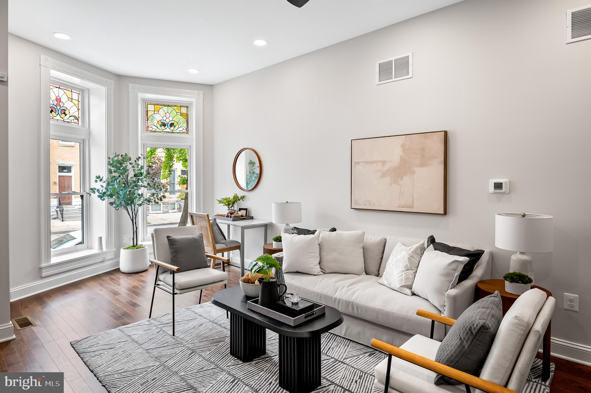 Modern design meets historic charm in the heart of Barclay. This three-bedroom, two-and-a-half bath CHAP Tax Credit renovation is solar-ready and includes a deck, garden, and off-street parking. Significant property tax savings thanks to the pending 10-year CHAP historic tax credit. While priced at $395,000 the significant property tax savings thanks to the pending CHAP historic tax credits will make your payments feel like you are buying a home in the $330,000 range. Home is eligible for Baltimore City's Vacant to Value $10,000 booster grant. Property approved for the Healthy Neighborhood Special Purchase Program, providing an interest rate 1% below market rates.
Welcome to your urban oasis in the vibrant Barclay neighborhood, where thoughtful design, quality craftsmanship, and city convenience converge. Designed by Trace Architects and built by Edgemont Builders, this home delivers clean, modern lines with timeless functionality. 432 East 22nd is fully electric and built solar-ready, designed with indoor air quality and long-term energy savings in mind, offering not only peace of mind but future-forward sustainability. Step inside to an open-concept kitchen/living area perfect for everyday living and effortless entertaining. A separate dining room offers flexible space ideal as a formal dining room, cozy den, or creative studio. A generous fully fenced garden is the perfect spot for pets and people and is suitable for outdoor dinners, container gardening, or simply unwinding. A private parking pad accommodates one to two cars for ultimate city convenience. Upstairs, the second level features two spacious bedrooms, each with large walk-in closets, a beautifully finished hall bath, and a dedicated laundry room (washer-dryer hookups in place). The entire third floor is a serene primary suite retreat with high ceilings, generous light, and a calming atmosphere that invites relaxation. All upper levels feature abundant natural light and modern finishes, and the unfinished basement offers great storage potential or a workroom space. This is more than just a renovation—it’s a reimagination of Baltimore rowhome living, blending contemporary comfort, architectural integrity, and smart sustainable living. Just blocks from Station North, Penn Station, and local restaurants, markets, and cultural hotspots.