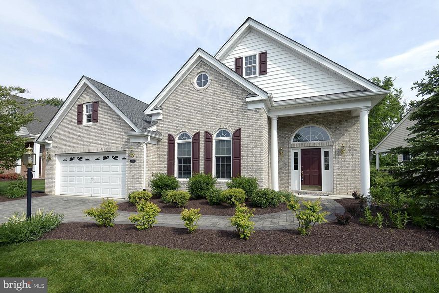 FANTASTIC private view in premier active adult community. Upgraded with Brazilian cherry floors, Family Rm extension and additional windows for maximum sunlight.  Kitchen with cherry cabinets and granite counters with tile backsplash.  Master bedroom has two walk in closets.  Storage in garage attic. Paver drive and walkway, stone porch and paver patio in fenced backyard w/ underground sprinklers.