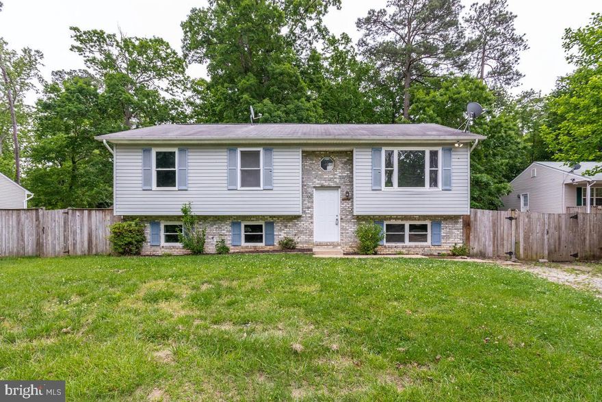 Nice 5 bedroom split foyer  located  in a private beach front community - offers kitchen w/ center island, good size  dining  &  living room, 3 bedrooms & 2 full baths on main level.   The 
lower level  offers a LARGE family room,  full bath, and 2 more bedrooms.  
Deck is conveniently off the kitchen/ dining area and is perfect for relaxing while watching your family & fur babies enjoying this oversized backyard  that is fully fenced -In with a privacy fence -   Plenty of backyard fun & cook outs!
Driveway offers enough room for 2 cars,  with off street parking available. 

Conveniently located close to Pax River navel air station, shopping, dining, parks, water park, and local beaches.

Come see for yourself and check out the nice beach included with this home -  Just in time for all your summer fun!