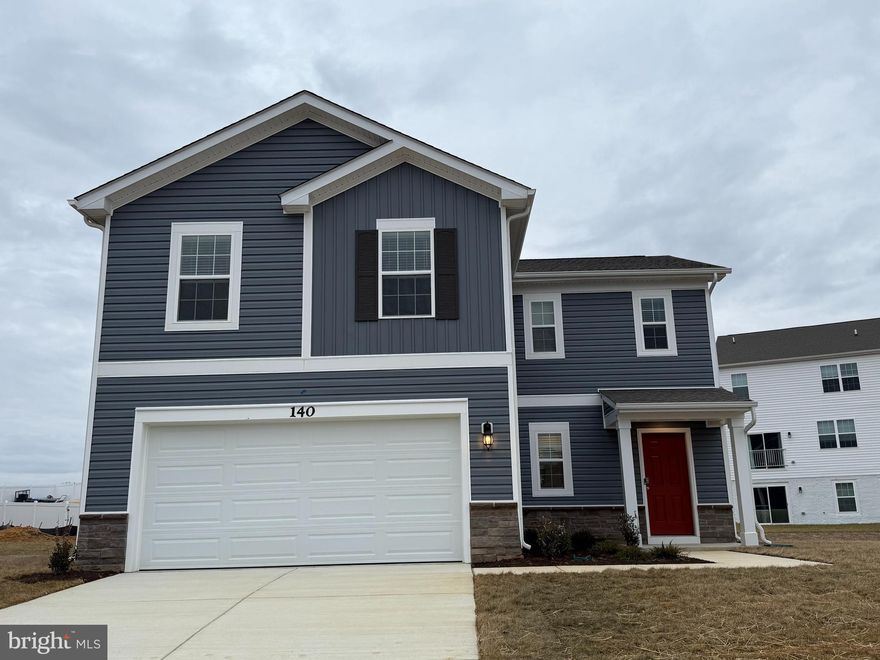 This 4 bedroom /2.5 baths sits on a cul-de-sac With a large  kitchen features a walk-in pantry and a large island with a double sink, which gives plenty of room for entertaining. Stainless steel appliances, 25 cu ft side by side refrigerator with multi cycle dishwasher, disposal, range and microwave with Aristokraft kitchen cabinetry, LED work area kitchen lighting and granite countertops. America's "Smart Home Technology" featuring Quisys IQ HD touchscreen with camera, Wi-Fi video doorbell, Echo Dot speaker with Alexa, Z-Wave programmable thermostat, smart light switch and Keyless Entry front door lock with deadbolt, flat screen prewires with cat-6 outlets in owners suite and living area, and finally a Wi-Fi enabled garage door opener. LVP flooring on main level, laundry and bathroom areas, wall to wall carpeting in bedrooms, and LVP on main level and bathrooms. ceiling fan pre-wires