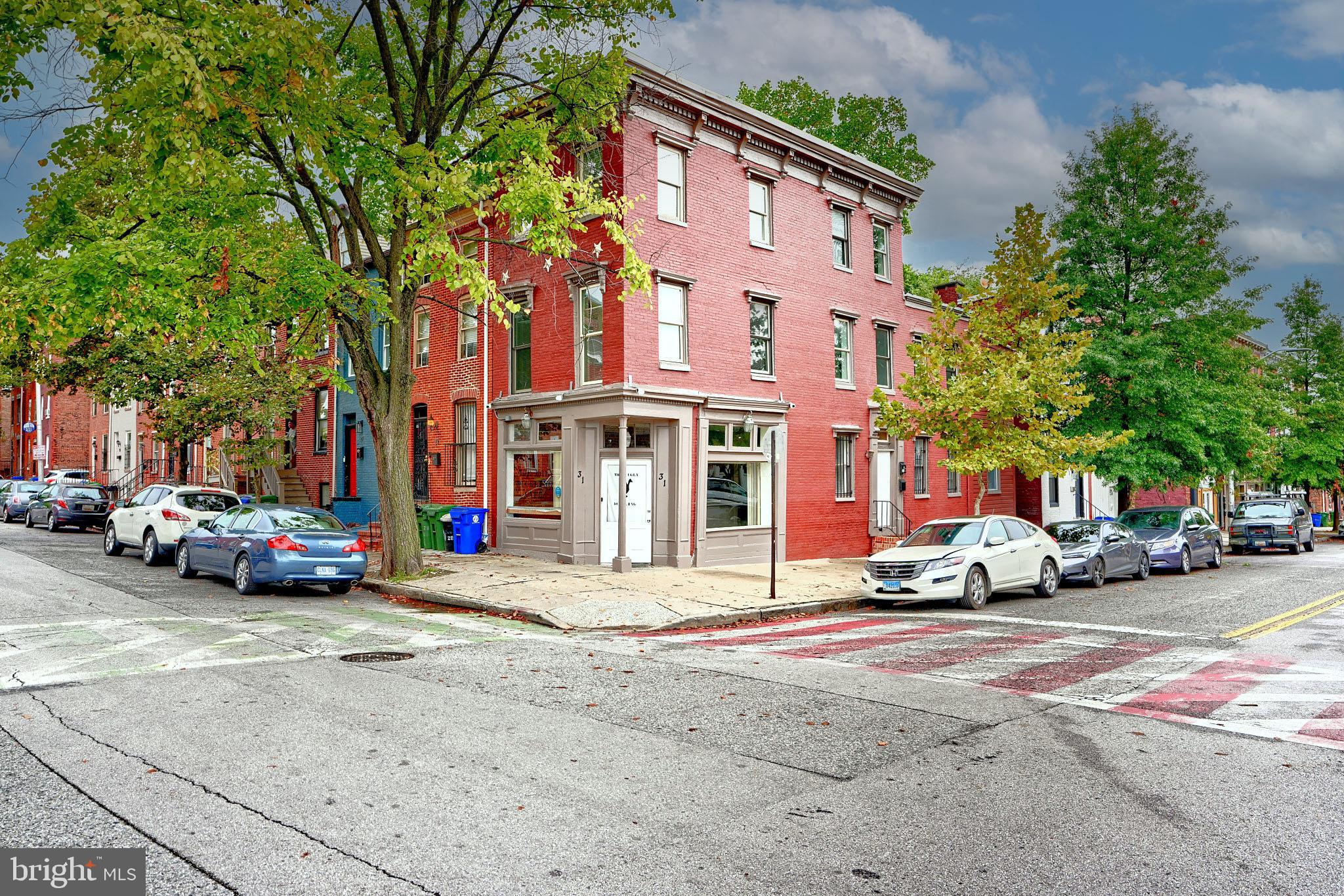 Price just reduced! Welcome to this versatile 3-unit corner building, perfectly positioned diagonally from the newly renovated Hollins Market! This property offers a fantastic opportunity for investors and business owners alike, situated in a vibrant neighborhood that has recently undergone significant revitalization. The first floor features a spacious commercial space, previously operated as a restaurant, providing high visibility and potential for various business ventures—whether you want to revive the culinary scene or introduce a new concept. Upstairs, the second floor boasts a charming 1-bedroom apartment, perfect for tenants seeking a cozy living space, while the third floor offers a convenient efficiency unit, ideal for singles or short-term rentals, further enhancing your investment potential.
With its prime location just steps away from the bustling market and conveniently close to UMAB Hospital and Downtown Baltimore, this property stands out for its accessibility and foot traffic. The ongoing revitalization of the area promises growth and increased demand, making this a terrific long-term investment opportunity. Don’t miss your chance to own a piece of this dynamic neighborhood! Whether you're looking to invest, start a business, or explore creative living options, this property has it all. Schedule your showing today and envision the possibilities!
