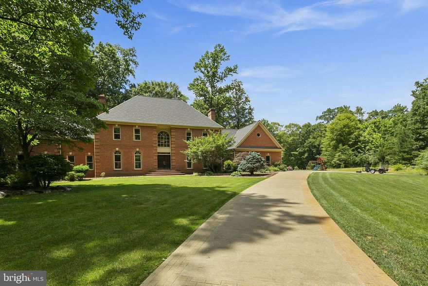OFFER DEADLINE, MONDAY, FEBRUARY 28TH AT 1PM.  Custom stately elegance in Quailwood Manor with privacy on five secluded acres, at the end of cul-de-sac. Attention to detail throughout, including hardwood floors on both levels and inlaid wood floors in the kitchen and hall. Formal living and dining rooms both with wood-burning fireplaces. Gourmet kitchen with granite countertops, tile backsplash, new GE gas cooktop, new Kitchen Aid refrigerator, new Kitchen Aid dual wall ovens, large center island, and breakfast room surrounded by sunny windows. Cozy family room with a fieldstone hearth and fireplace. The main floor en suite bedroom features a generous sitting area with a wood-burning fireplace, walk-in closet, jetted soaking tub, and a private office. The upper level includes a primary suite with a private office/sitting area and an en suite bathroom with a soaking tub, walk-in shower and dual vanities. Three additional bedrooms, two full bathrooms, and a versatile bonus room are also on the upper level. Over $160,000 in updates since 2019 including roof, brand new windows throughout, well water system, two HVAC systems, appliances, chimney cap, garage door openers, septic tank pump, and fresh paint.