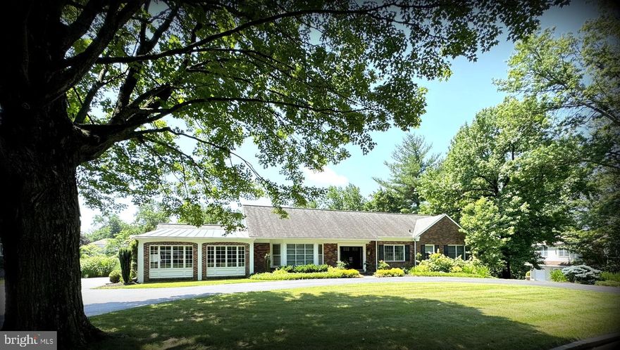 Welcome to 1017 Walsh Lane, a beautifully expanded brick Cape Cod nestled on a serene cul-de-sac street in the heart of Penn Valley. Set well back from the street on a lush, nearly 3/4 +/- acre lot, this impeccably maintained home offers the perfect blend of timeless character, modern amenities, & exceptional convenience just minutes from Center City, top schools, & all major roadways.
A circular driveway leads to the gracious double door Center Hall entrance. Inside, the home opens to an inviting Living Room with a large bay window & flowing into the formal Dining Room. French doors welcome you into a stunning vaulted-ceiling Sunroom with heated floors, bathed in natural light.
 The Kitchen is a chef’s dream with custom cabinetry, a large island with granite counters, premium appliances & open to the Family Room with a cozy fireplace. Step outside to an awninged terrace, overlooking the sparkling pool & expansive patio perfect for summer entertaining.
The spacious main-level Primary Suite features dual walk-in dressing rooms & a spa-like bath with heated floors, oversized shower, soaking tub & private water closet. A second bedroom & hall bath with heated floors complete this level.
Upstairs, a bright lounge with wall of windows & skylights, built-ins & hardwood floors provides a versatile retreat. Two additional bedrooms, each with skylights, hardwood floors & generous closets, share a large hall bathroom.
The walk-out lower level is flooded with light & offers abundant living space including a media area, game area, powder room, plus extensive storage options including a cedar closet & laundry room.
Additional features include a 2-car garage, professional landscaping & a quiet, tree-lined street in the award-winning Lower Merion School District.
This warm & welcoming home combines elegance, comfort & location in a way that’s rarely available don’t miss your opportunity to make it yours!